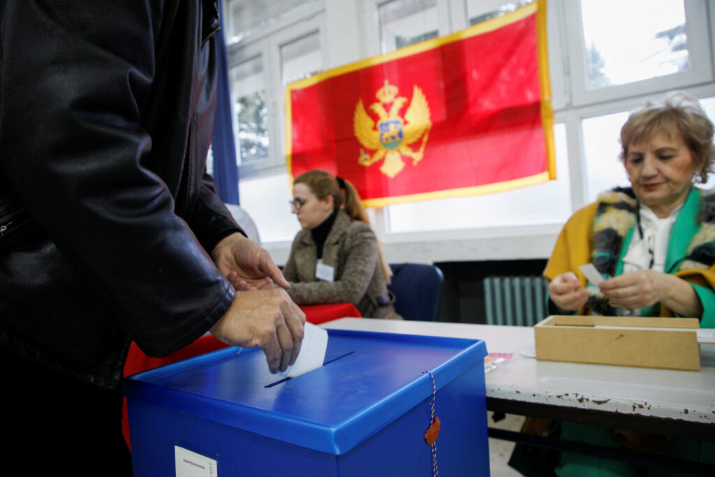 A man casts his vote at a polling station during the run-off presidential election in Podgorica, Montenegro, April 2, 2023. REUTERS/Stevo Vasiljevic