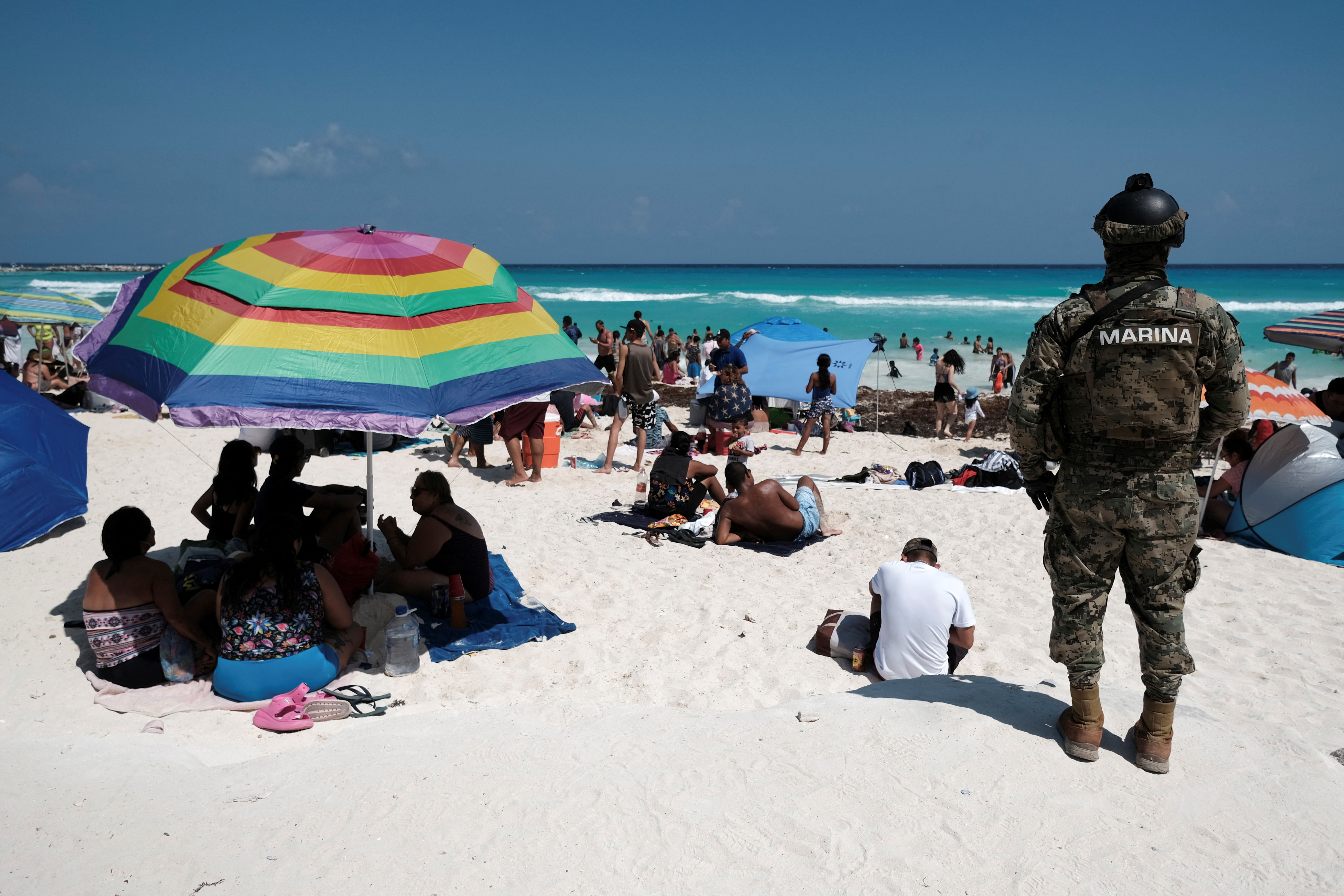 A Mexican Marine keeps watch at Gaviota Azul beach as part of the security measures during Holy Week in Cancun, Mexico April 7, 2023. REUTERS/Paola Chiomante