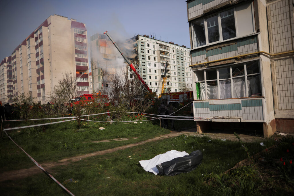 Dead bodies in plastic bags lie on the ground near the site of a heavily damaged residential building hit by a Russian missile, amid Russia's attack on Ukraine, in the town of Uman, Cherkasy region, Ukraine April 28, 2023. REUTERS/Carlos Barria