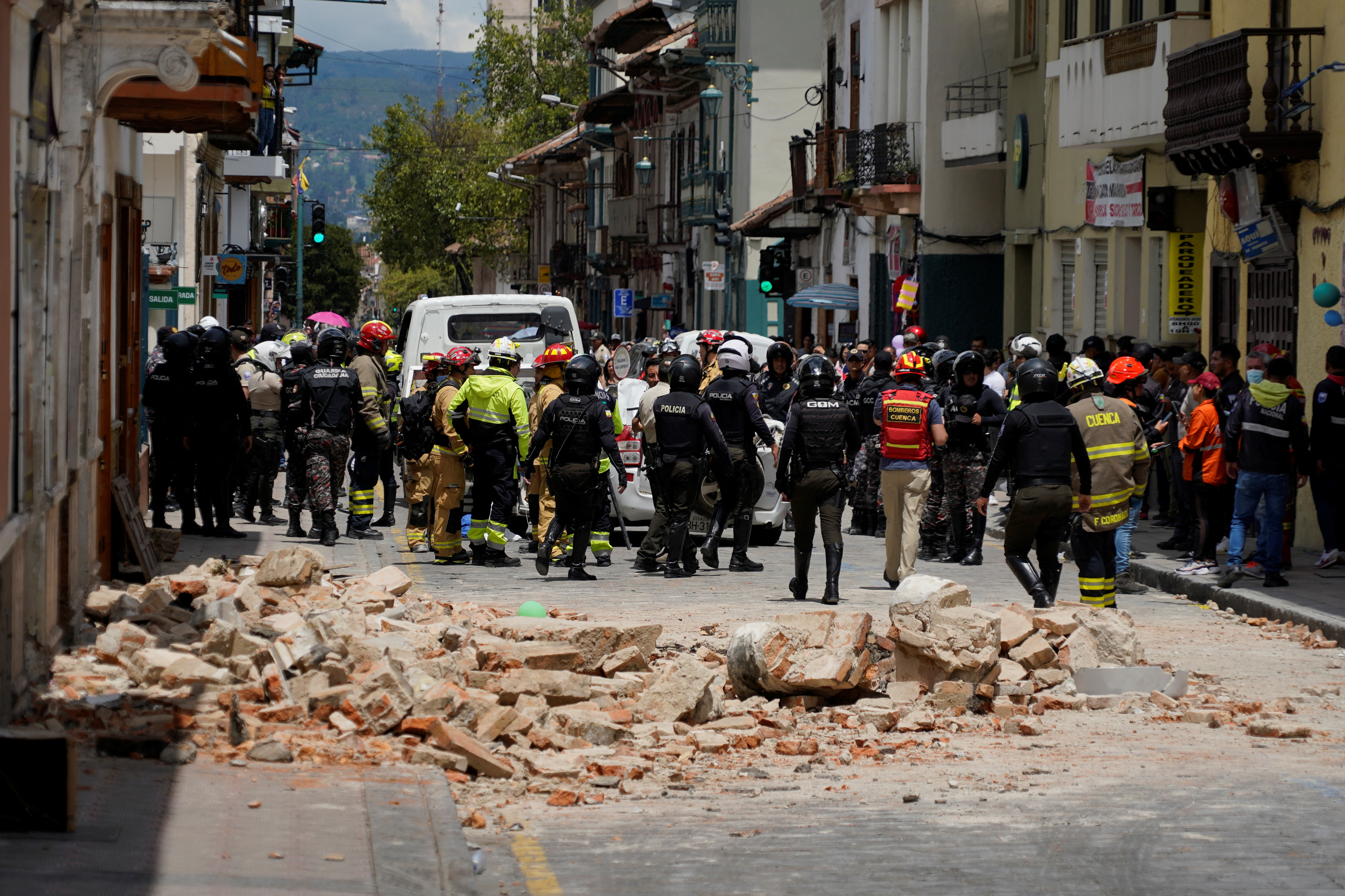 A damaged car and rubble from a house affected by the earthquake are pictured in Cuenca, Ecuador. March 18, 2023. REUTERS/Rafa Idrovo Espinoza NO RESALES. NO ARCHIVES