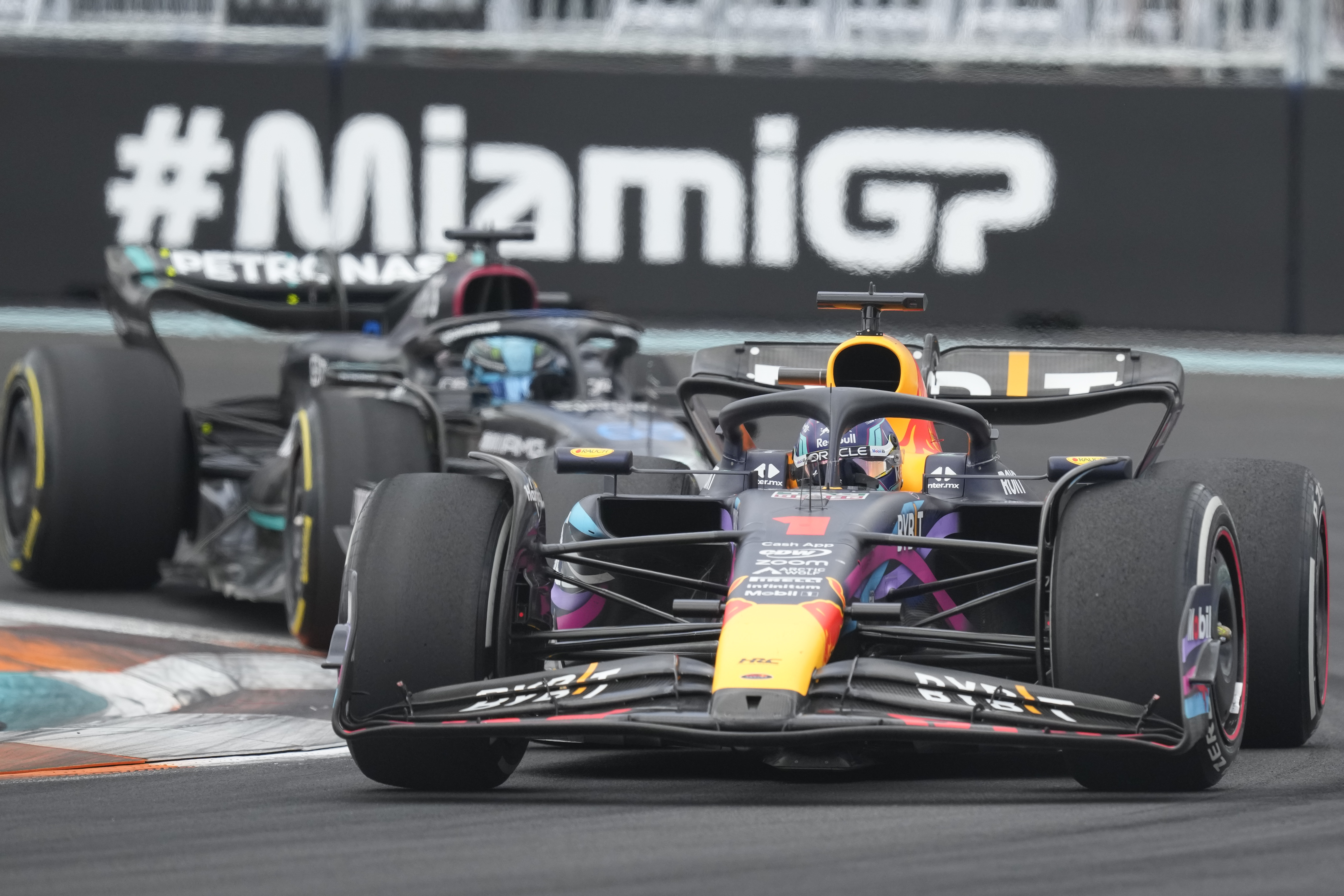 Red Bull driver Max Verstappen battles Mercedes driver George Russell (63) during the Formula One Miami Grand Prix auto race at the Miami International Autodrome, Sunday, May 7, 2023, in Miami Gardens, Fla. (AP Photo/Rebecca Blackwell)