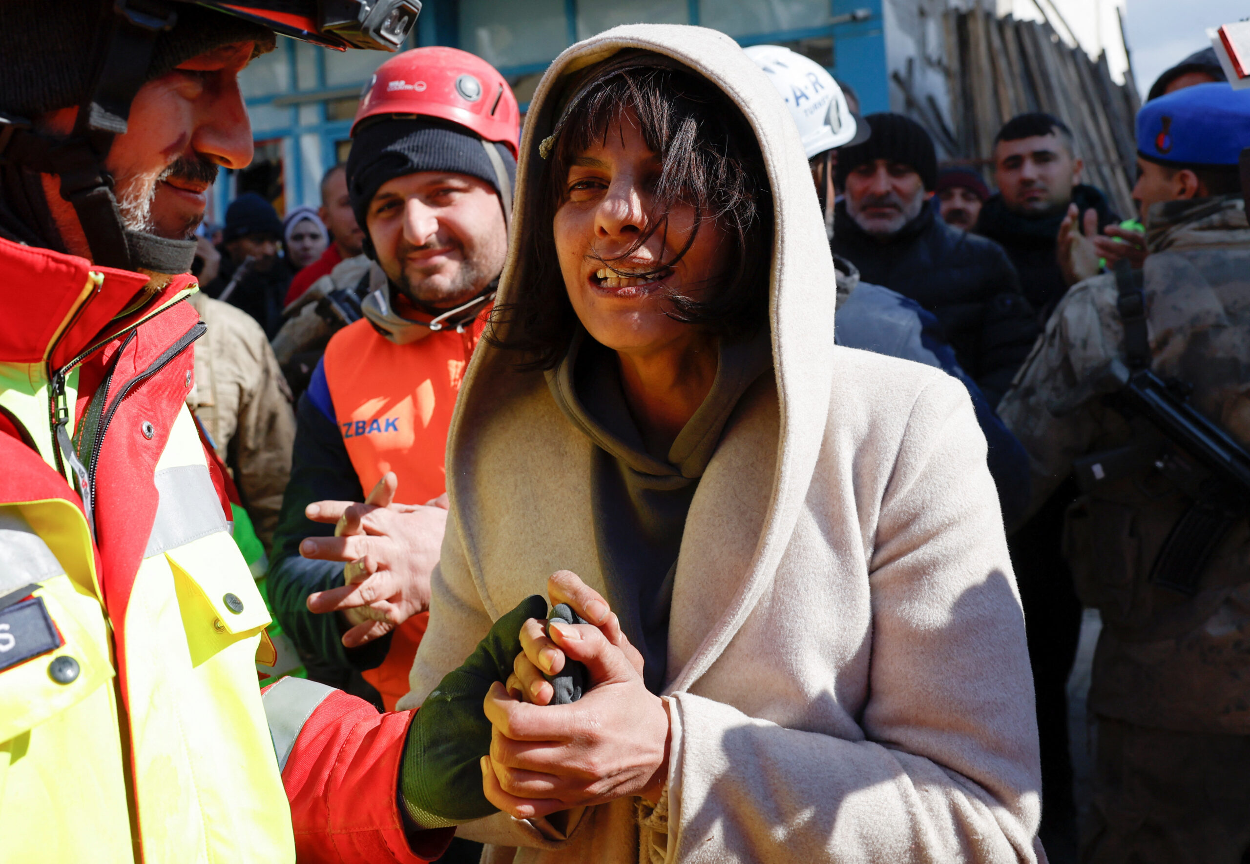 Zubeyde Kahraman, whose sister Zeynep, 40, has been rescued by ISAR Germany, reacts, as the search for survivors continues, in the aftermath of a deadly earthquake in Kirikhan, Turkey February 10, 2023. REUTERS/Piroschka van de Wouw