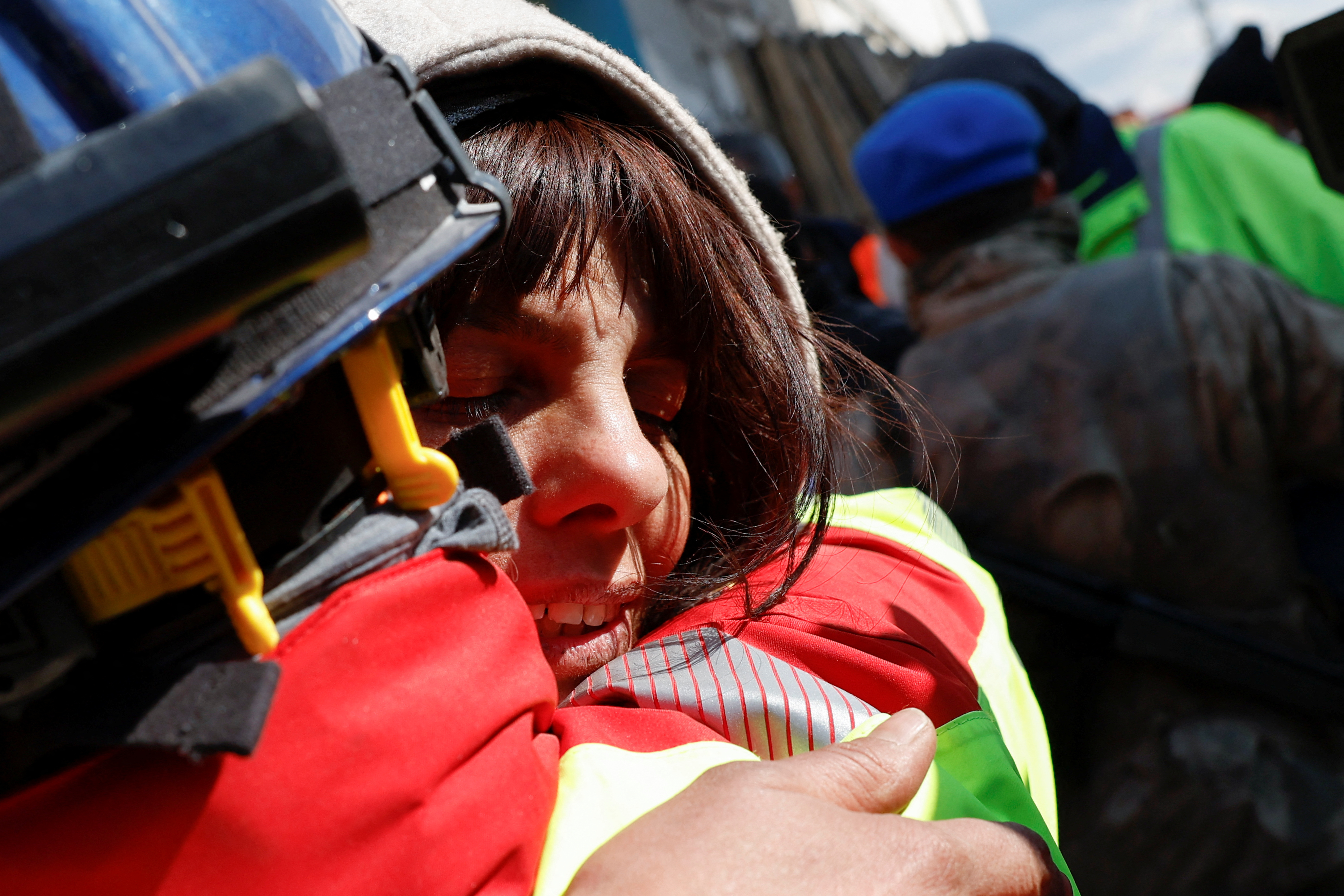 Zubeyde Kahraman, whose sister Zeynep, 40, has been rescued by ISAR Germany, reacts, as the search for survivors continues, in the aftermath of a deadly earthquake in Kirikhan, Turkey February 10, 2023. REUTERS/Piroschka van de Wouw
