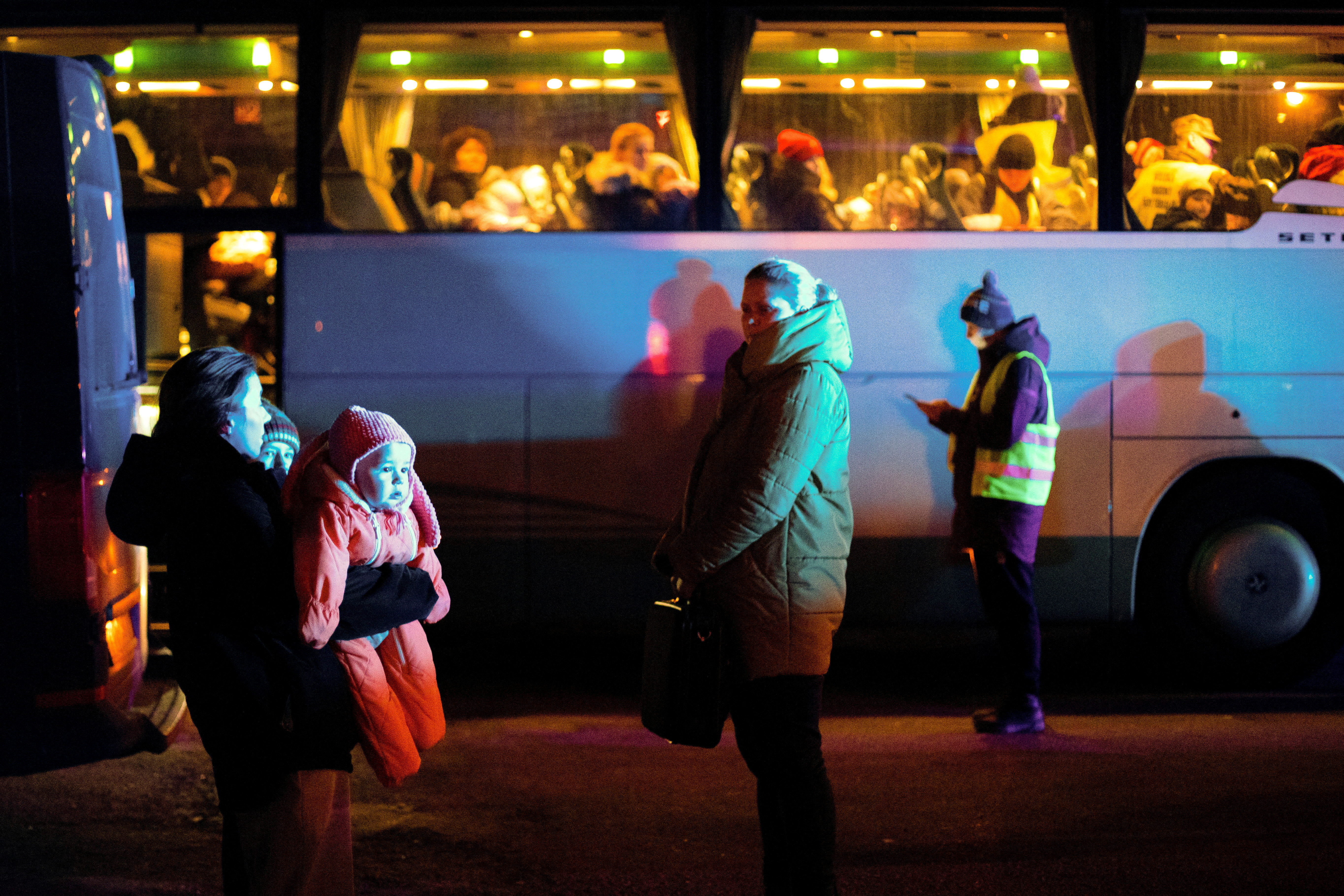 Ukrainian children evacuated from orphanages, in the Kyiv region, amid Russia's invasion of Ukraine are transported by buses to their temporary accommodation after arriving in Przemysl, Poland March 8, 2022. REUTERS/Kuba Stezycki     TPX IMAGES OF THE DAY