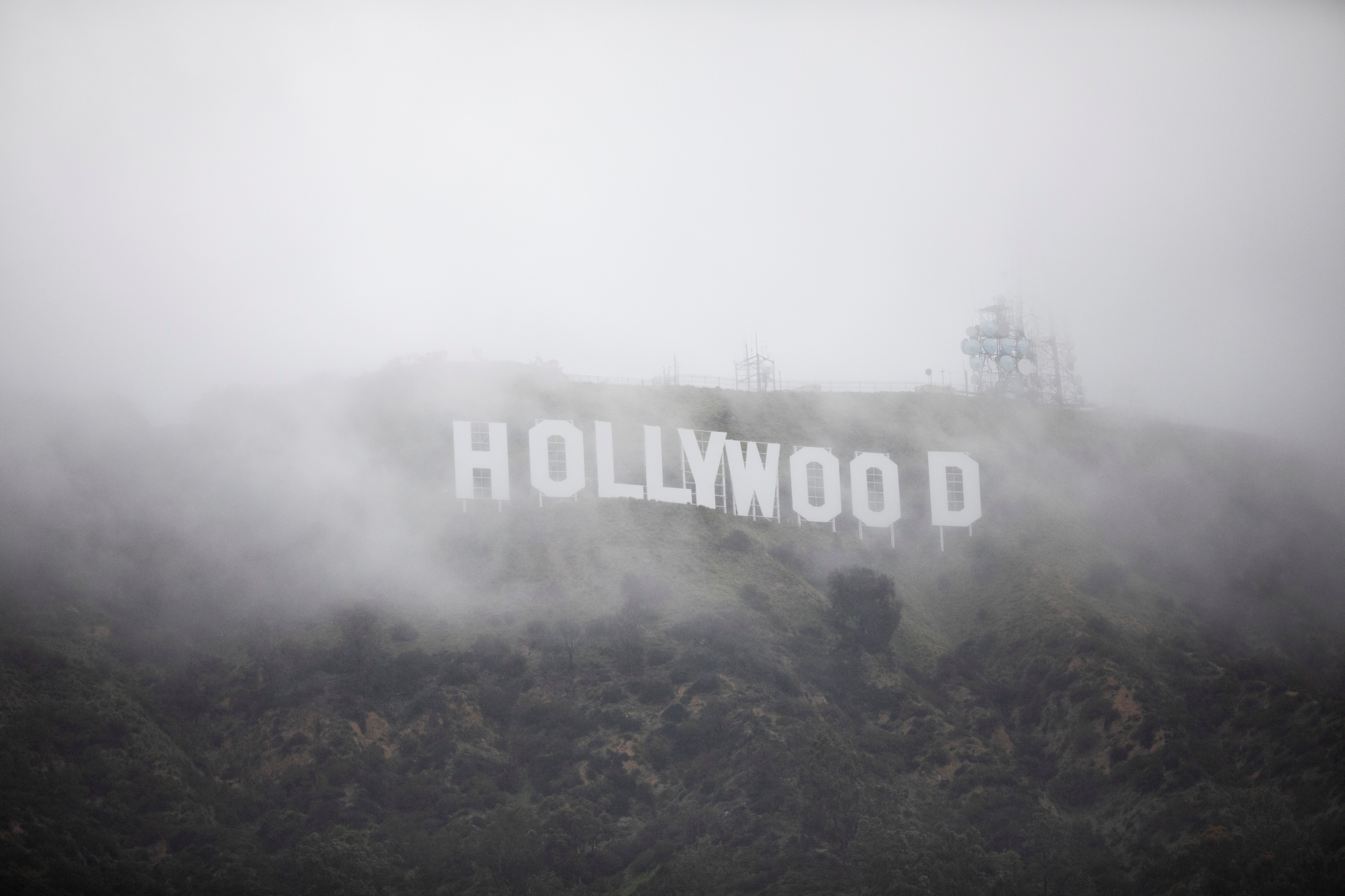 The Hollywood sign is seen through a mix of fog and dust snow during a rare cold winter storm in the Los Angeles area, in Los Angeles, California, U.S., February 24, 2023.  REUTERS/Aude Guerrucci
