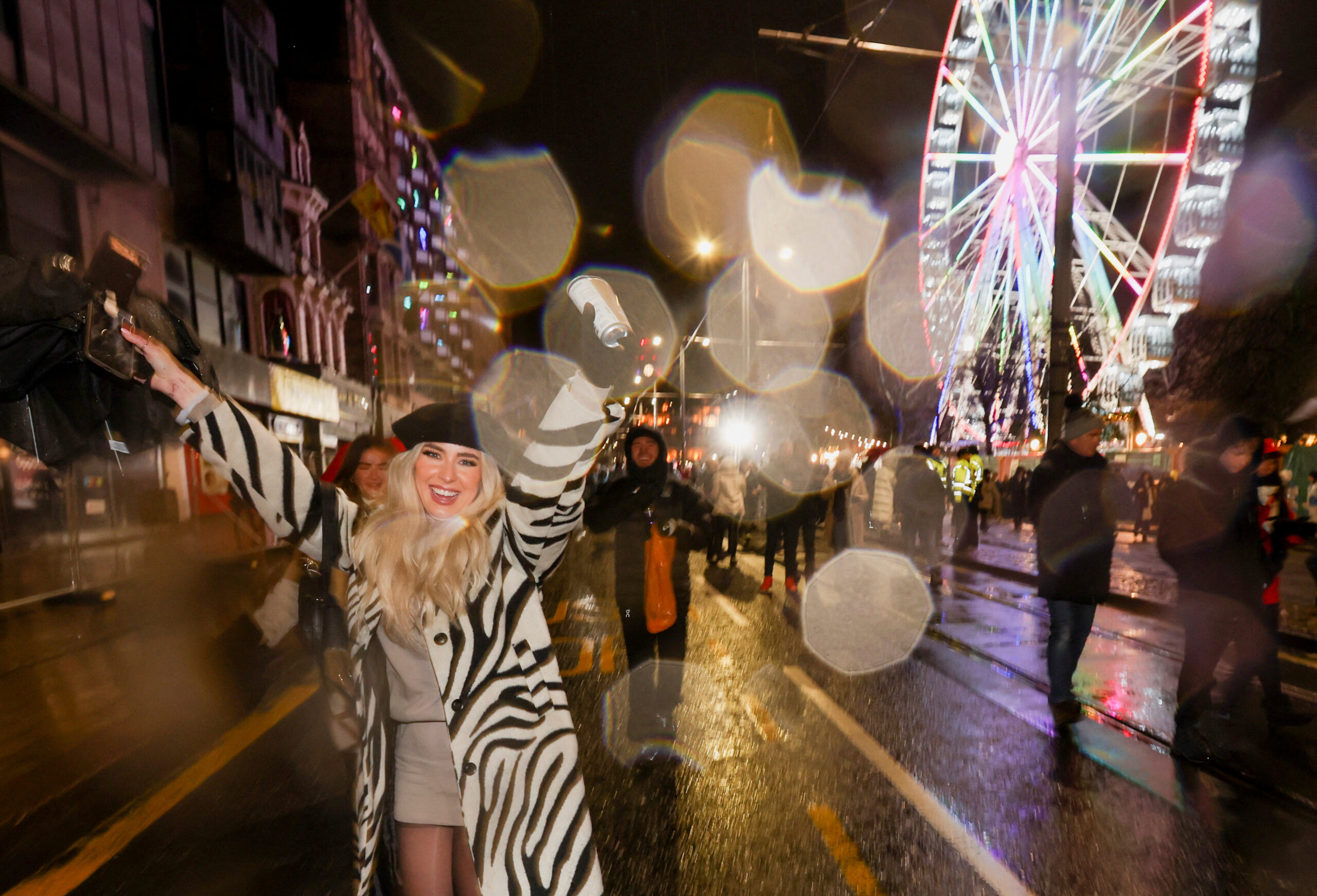 Revellers celebrate ahead of the New Year, in Edinburgh, Scotland, Britain December 31, 2022. REUTERS/Russell Cheyne