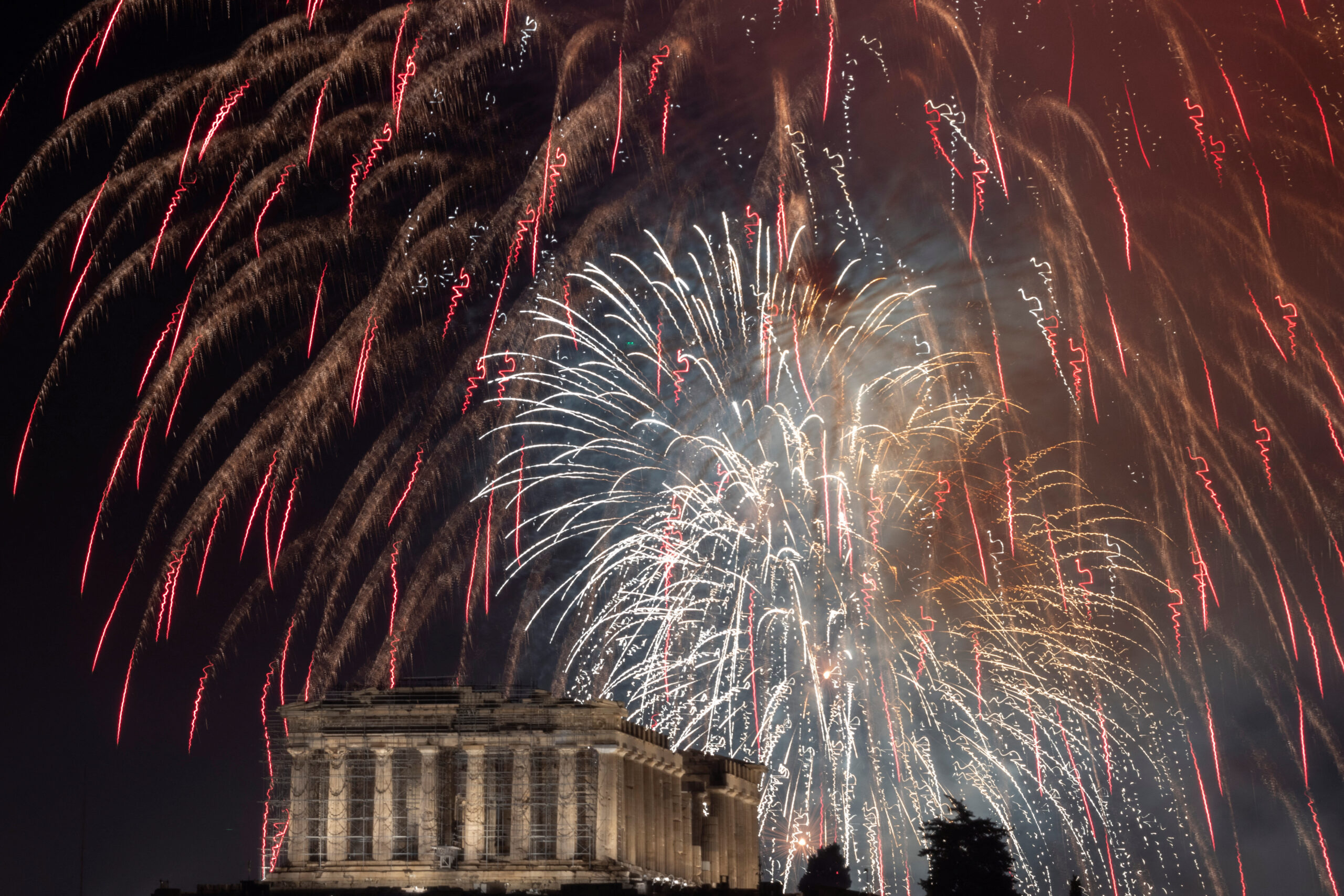 Fireworks explode over the ancient Parthenon temple atop the Acropolis hill during New Year's Day celebrations, in Athens, Greece, January 1, 2023. REUTERS/Stelios Misinas