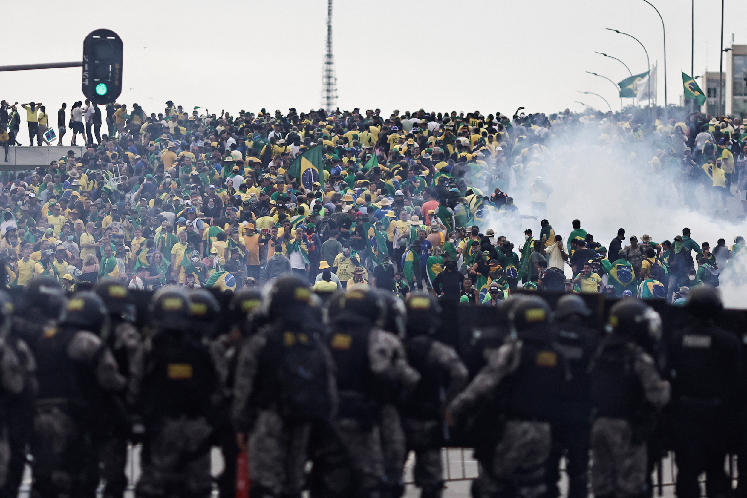 Security forces stand guard as supporters of Brazil's former President Jair Bolsonaro demonstrate against President Luiz Inacio Lula da Silva, in Planalto Palace, in Brasilia, Brazil, January 8, 2023. REUTERS/Ueslei Marcelino