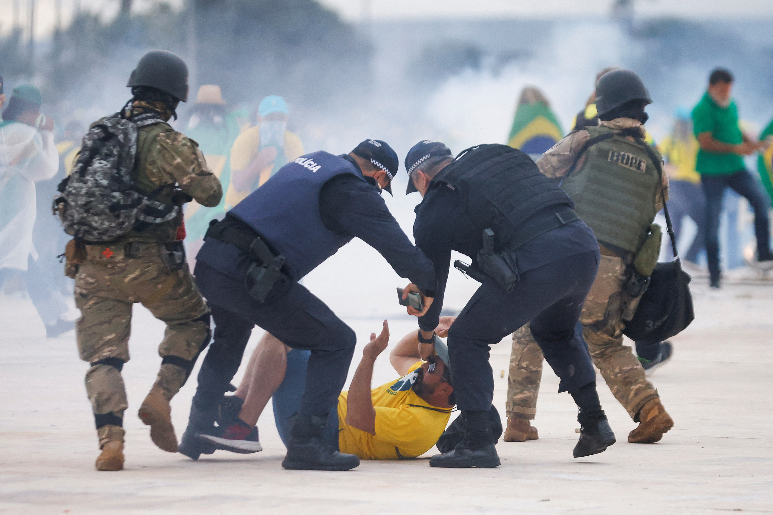 Security forces detain a supporter of Brazil's former President Jair Bolsonaro during a demonstration against President Luiz Inacio Lula da Silva, in Brasilia, Brazil, January 8, 2023. REUTERS/Adriano Machado