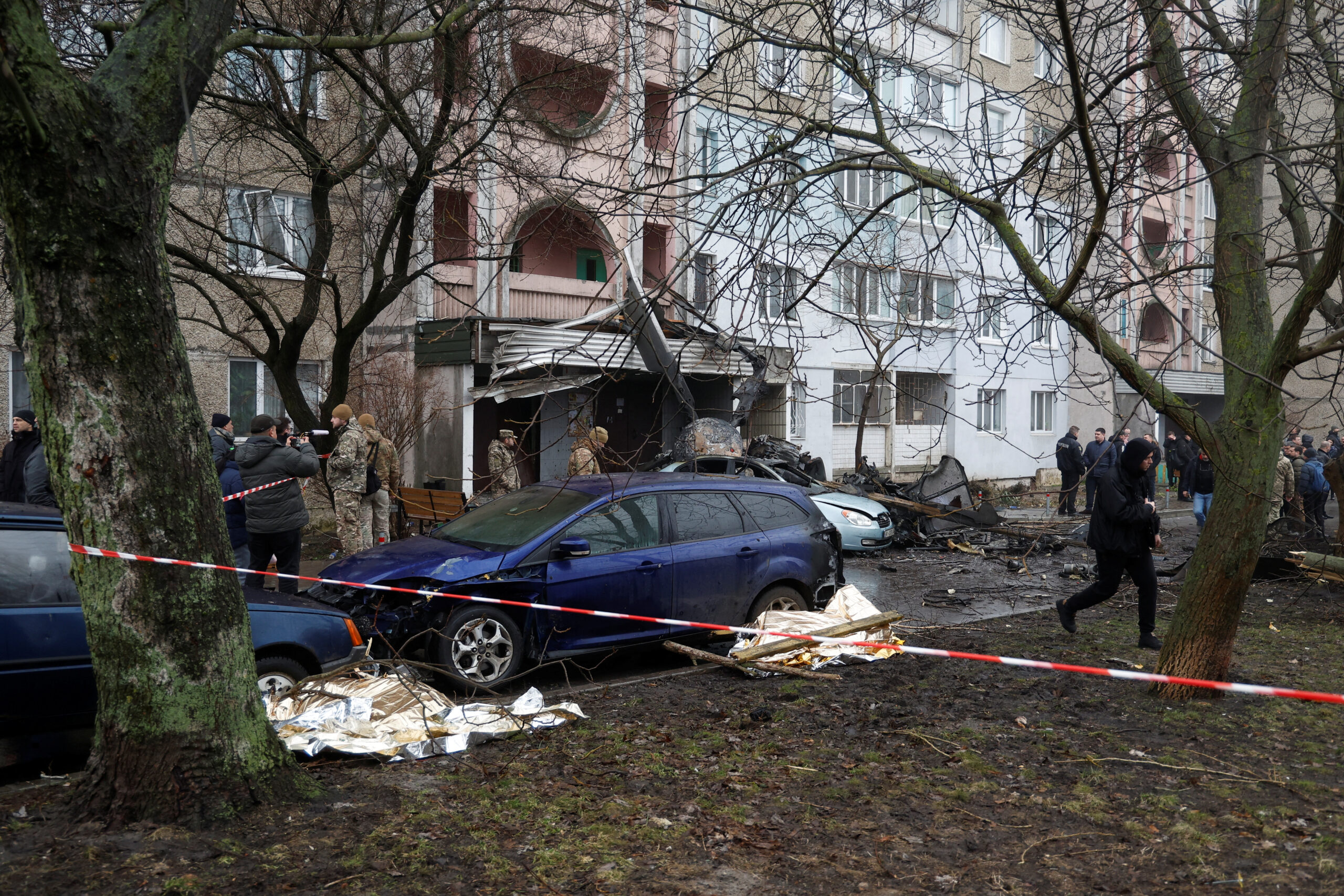 A view shows the site where a helicopter falls on civil infrastructure buildings, amid Russia's attack on Ukraine, in the town of Brovary, outside Kyiv, Ukraine, January 18, 2023. REUTERS/Valentyn Ogirenko