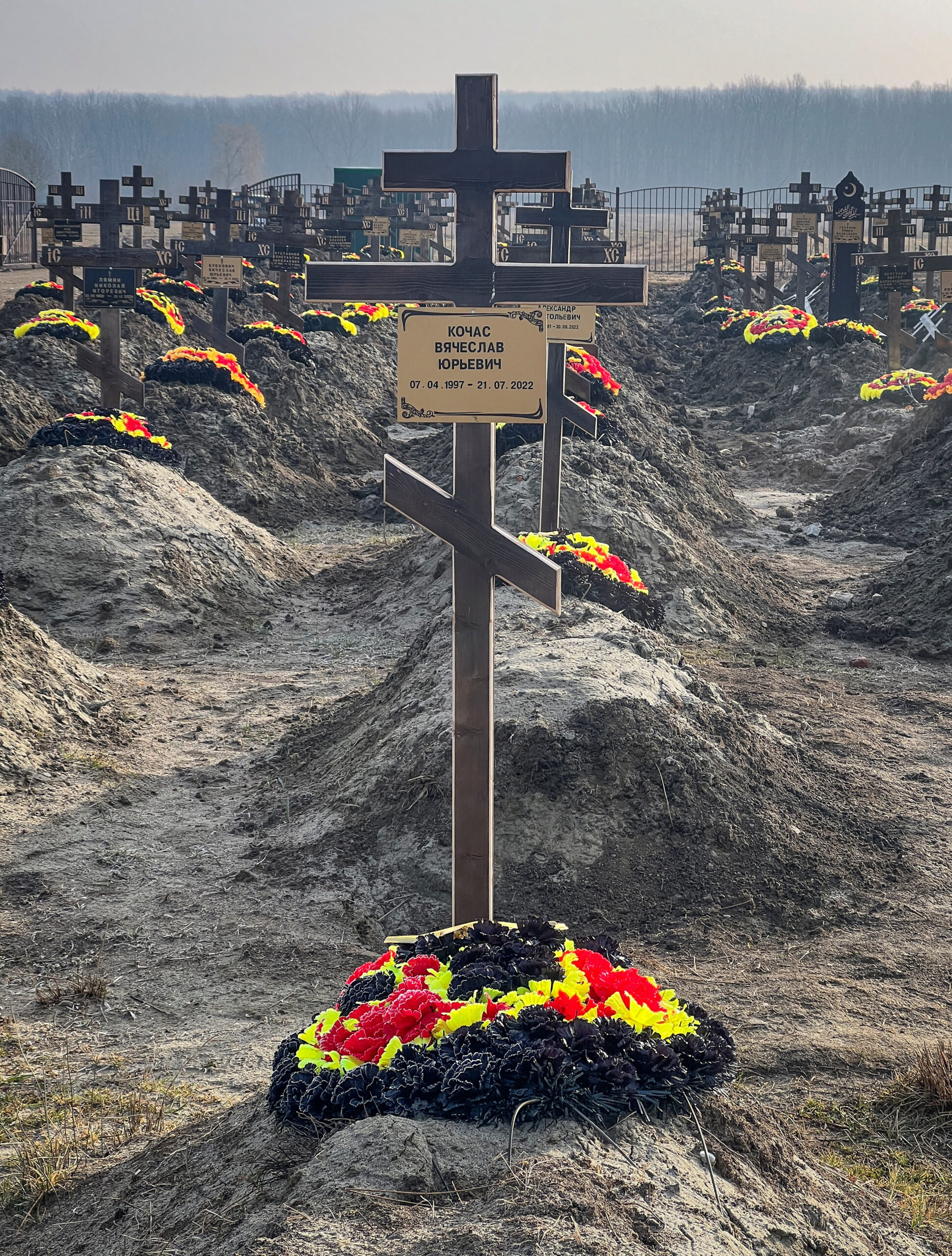 A plaque with the name of Russian Wagner mercenary group fighter and former convict Vyacheslav Kochas is seen on a grave cross at a cemetery near the village of Bakinskaya in southern Krasnodar region, Russia, January 22, 2023. REUTERS/Stringer