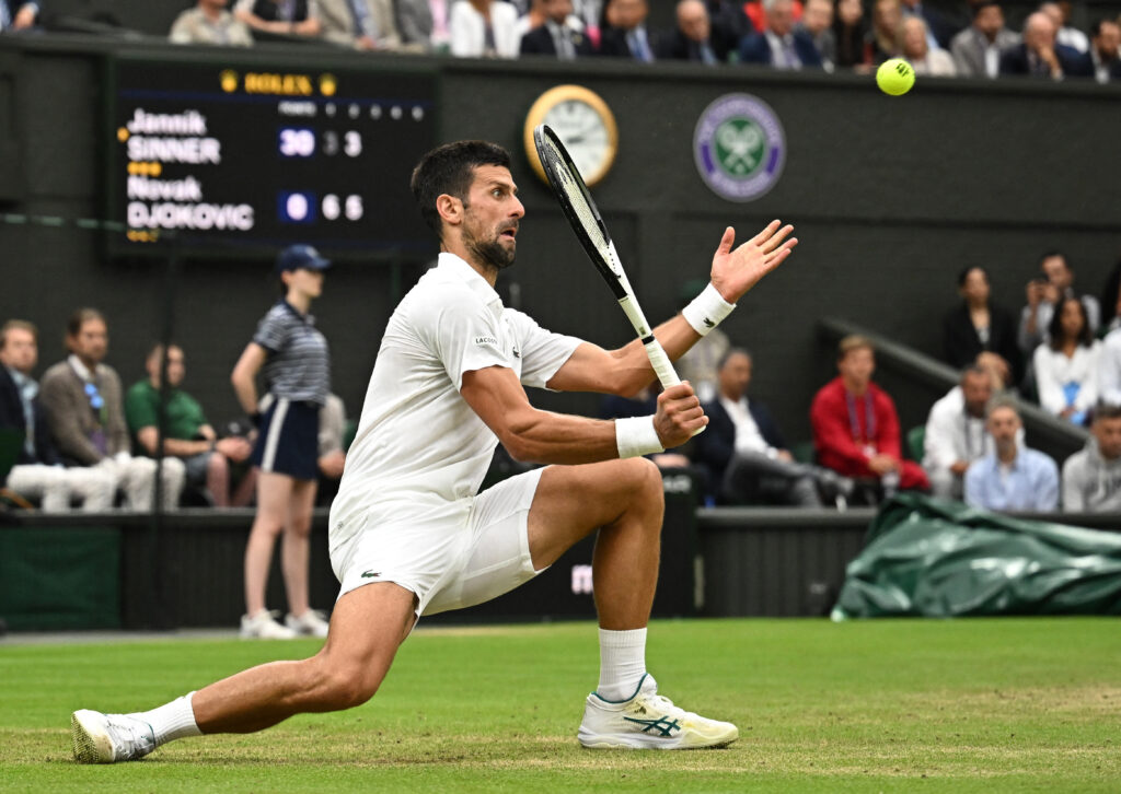 Tennis - Wimbledon - All England Lawn Tennis and Croquet Club, London, Britain - July 14, 2023 Serbia's Novak Djokovic in action during his semi final match against Italy's Jannik Sinner REUTERS/Dylan Martinez