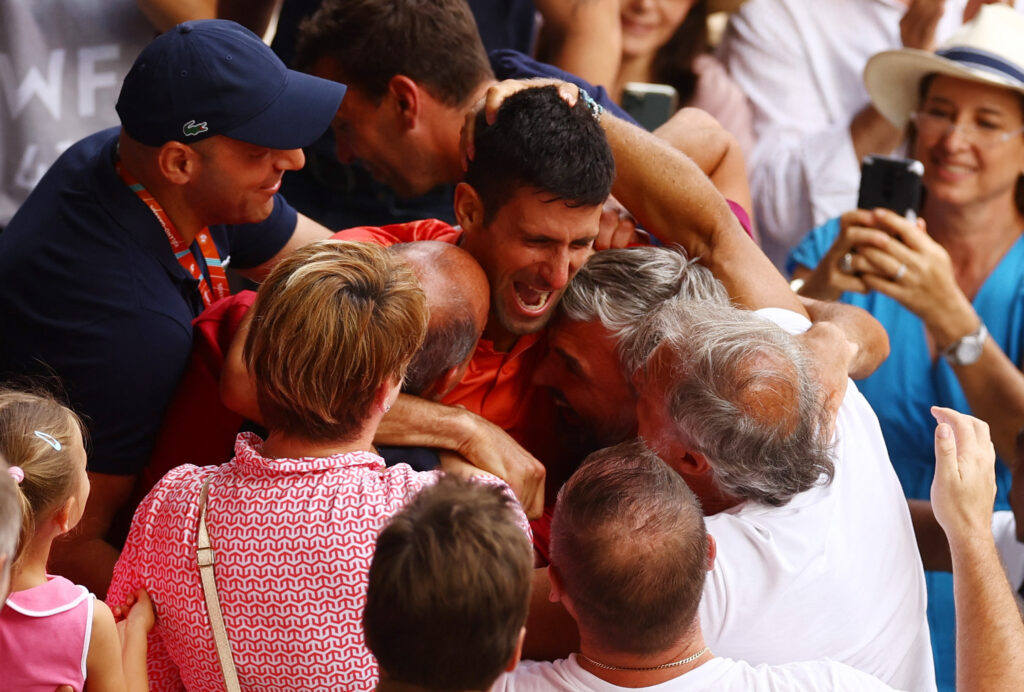 Tennis - French Open - Roland Garros, Paris, France - June 11, 2023 Serbia's Novak Djokovic celebrates with his team after winning the final against Norway's Casper Ruud REUTERS/Kai Pfaffenbach