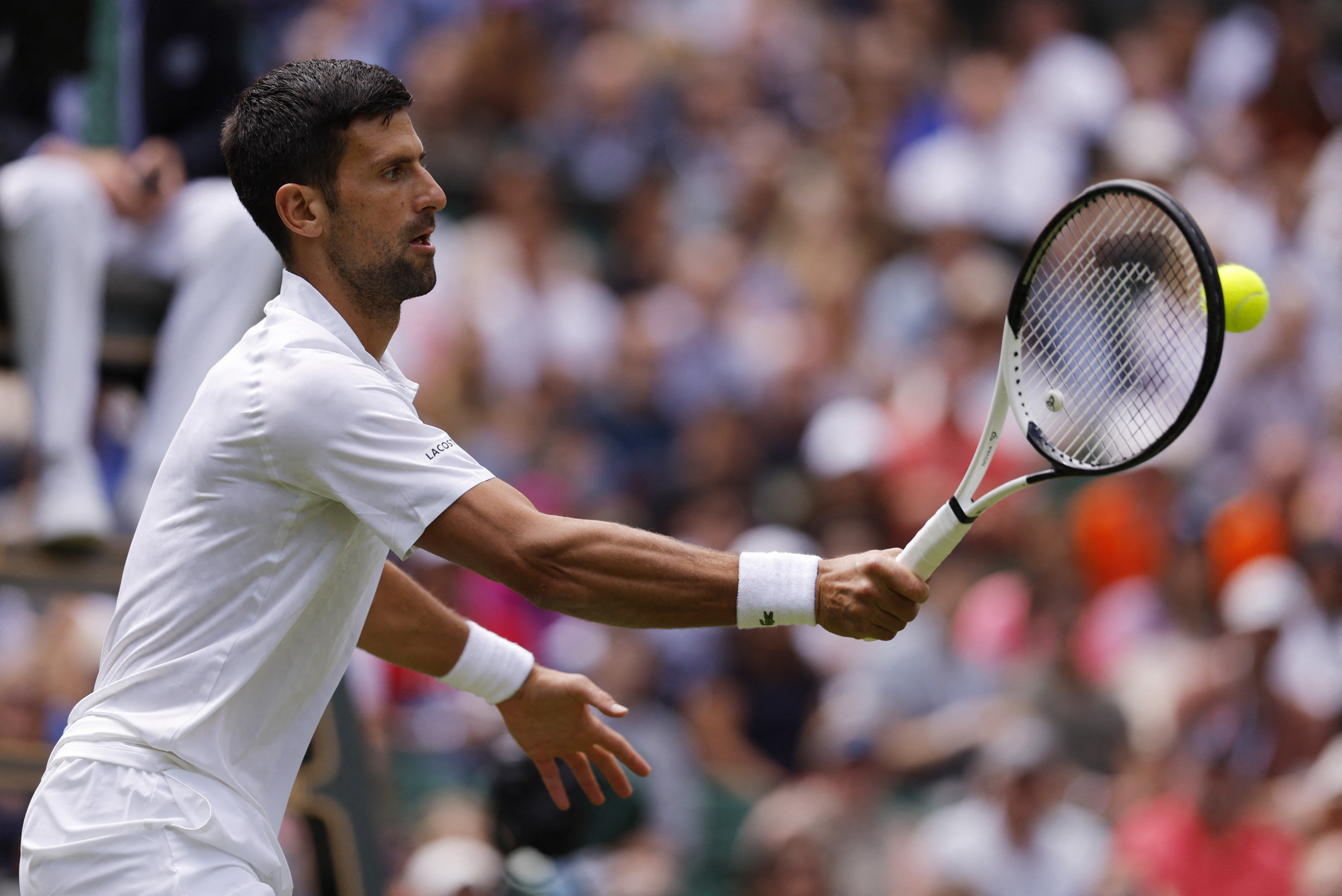 Tennis - Wimbledon - All England Lawn Tennis and Croquet Club, London, Britain - July 3, 2023 Serbia’s Novak Djokovic in action during his first round match against Argentina’s Pedro Cachin REUTERS/Andrew Couldridge