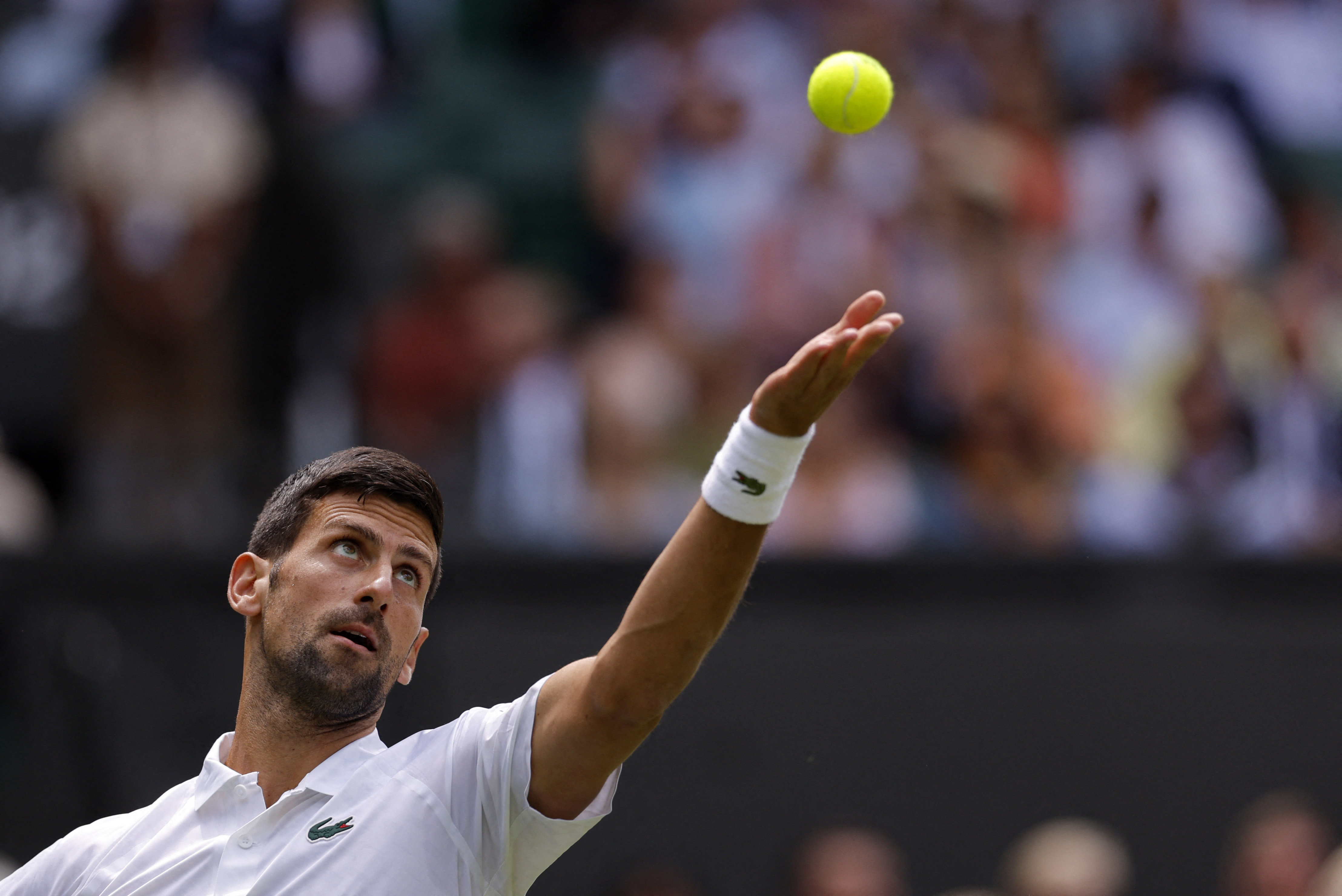 Tennis - Wimbledon - All England Lawn Tennis and Croquet Club, London, Britain - July 3, 2023 Serbia’s Novak Djokovic in action during his first round match against Argentina’s Pedro Cachin REUTERS/Andrew Couldridge