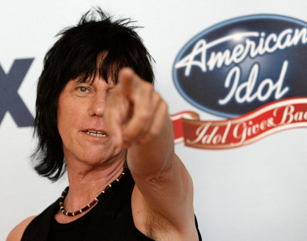 FILE PHOTO: Guitarist Jeff Beck gestures backstage during the "Idol Gives Back" show at the Walt Disney Concert Hall in Los Angeles April 25, 2007. REUTERS/Mario Anzuoni/File Photo
