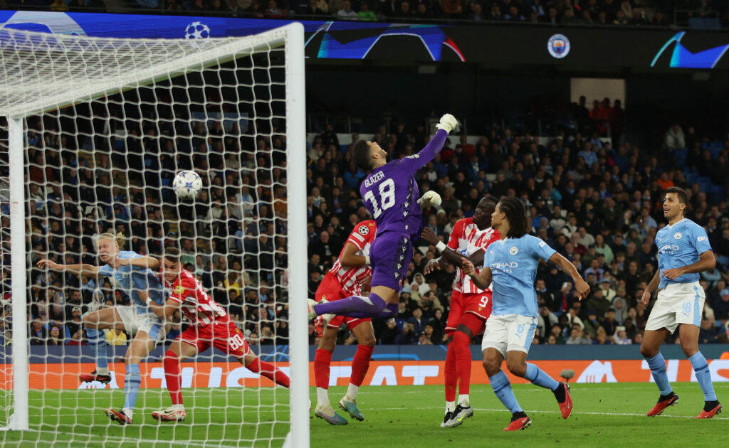 Soccer Football - Champions League - Group G - Manchester City v Crvena Zvezda - Etihad Stadium, Manchester, Britain - September 19, 2023 Manchester City's Julian Alvarez scores their second goal past Crvena Zvezda's Omri Glazer REUTERS/Phil Noble