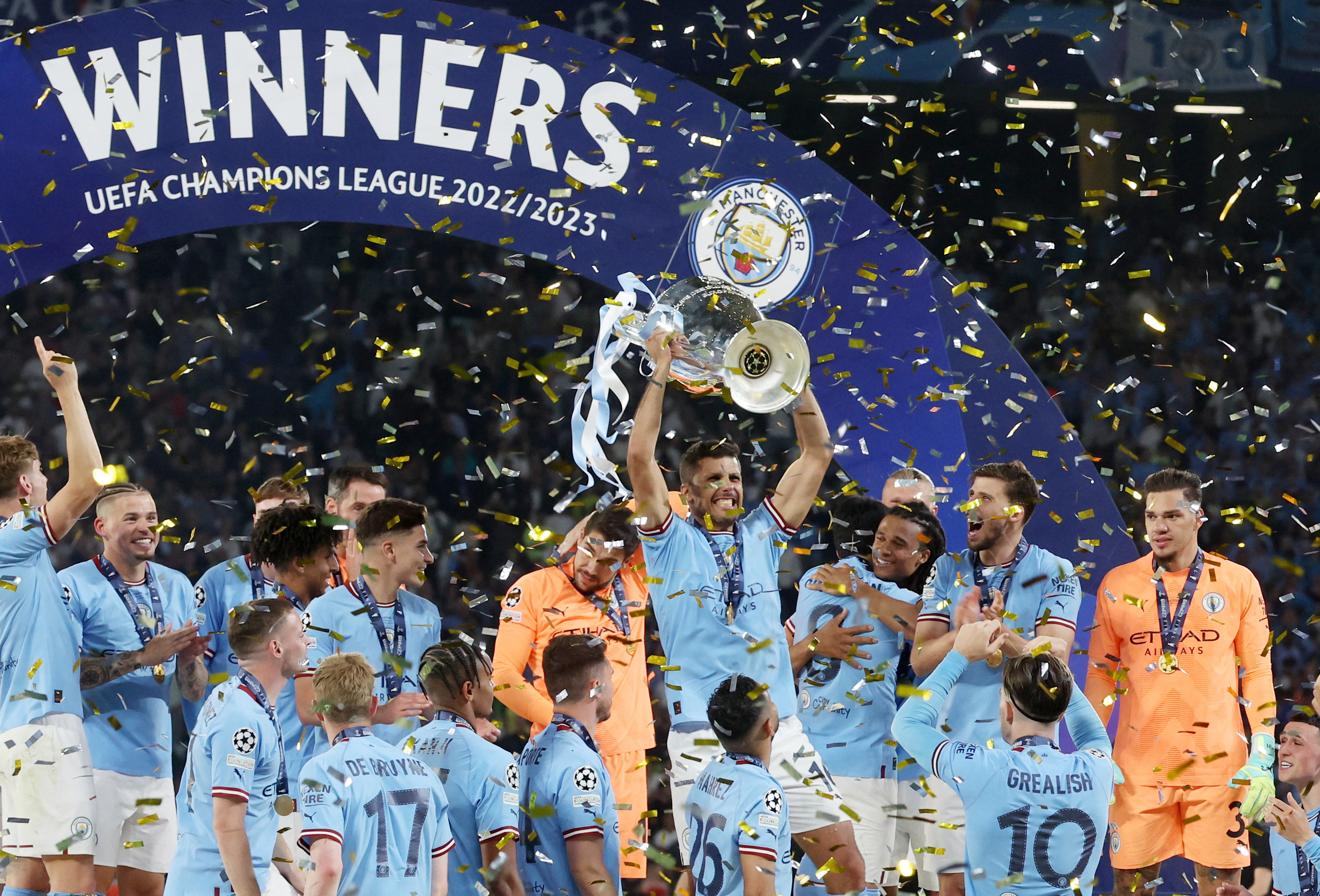 Soccer Football - Champions League Final - Manchester City v Inter Milan - Ataturk Olympic Stadium, Istanbul, Turkey - June 11, 2023 Manchester City's Rodri celebrates with the trophy and teammates after winning the Champions League REUTERS/Murad Sezer