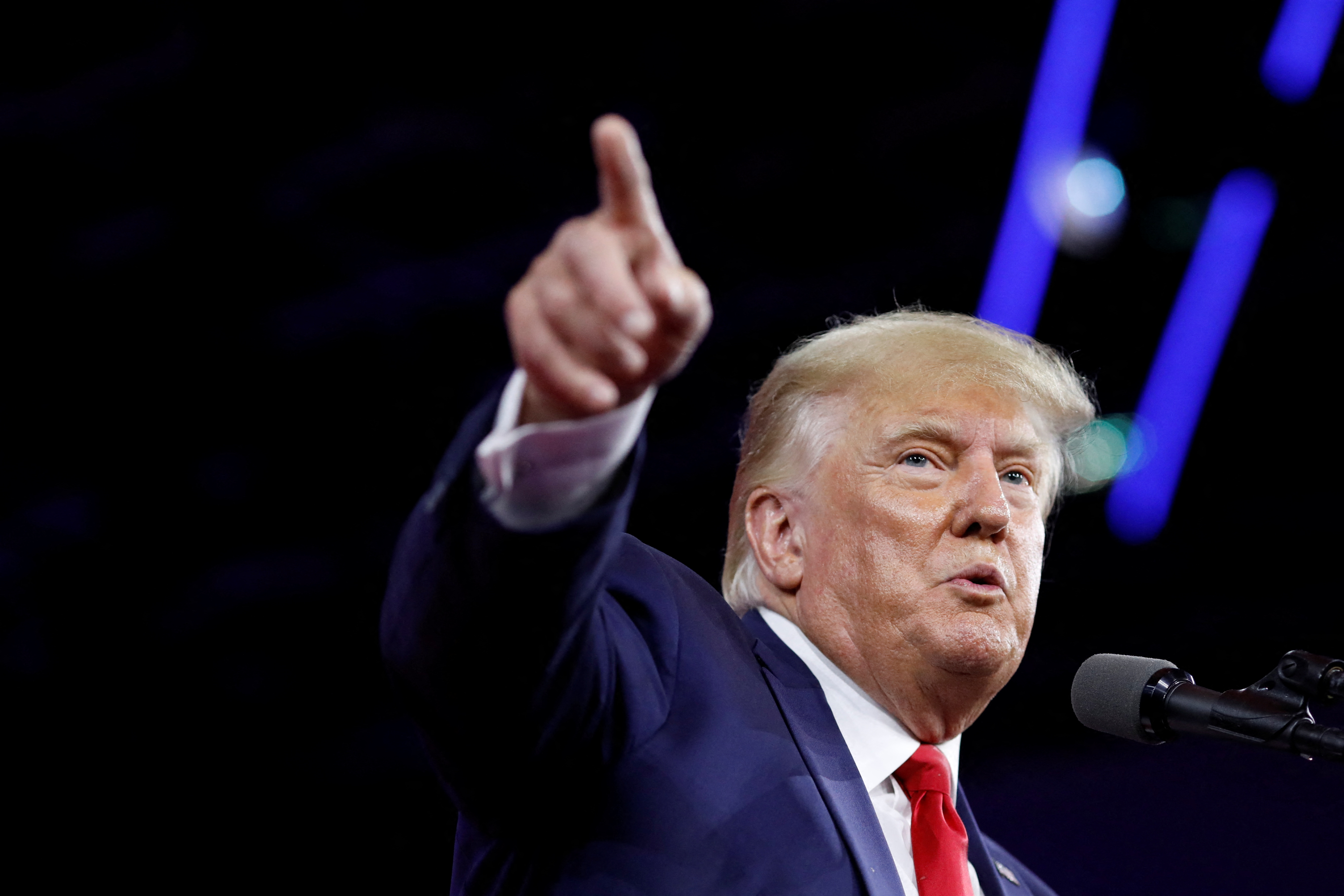 Former U.S. President Donald Trump gestures as he speaks during the Conservative Political Action Conference (CPAC) in Orlando, Florida, U.S. February 26, 2022. REUTERS/Marco Bello