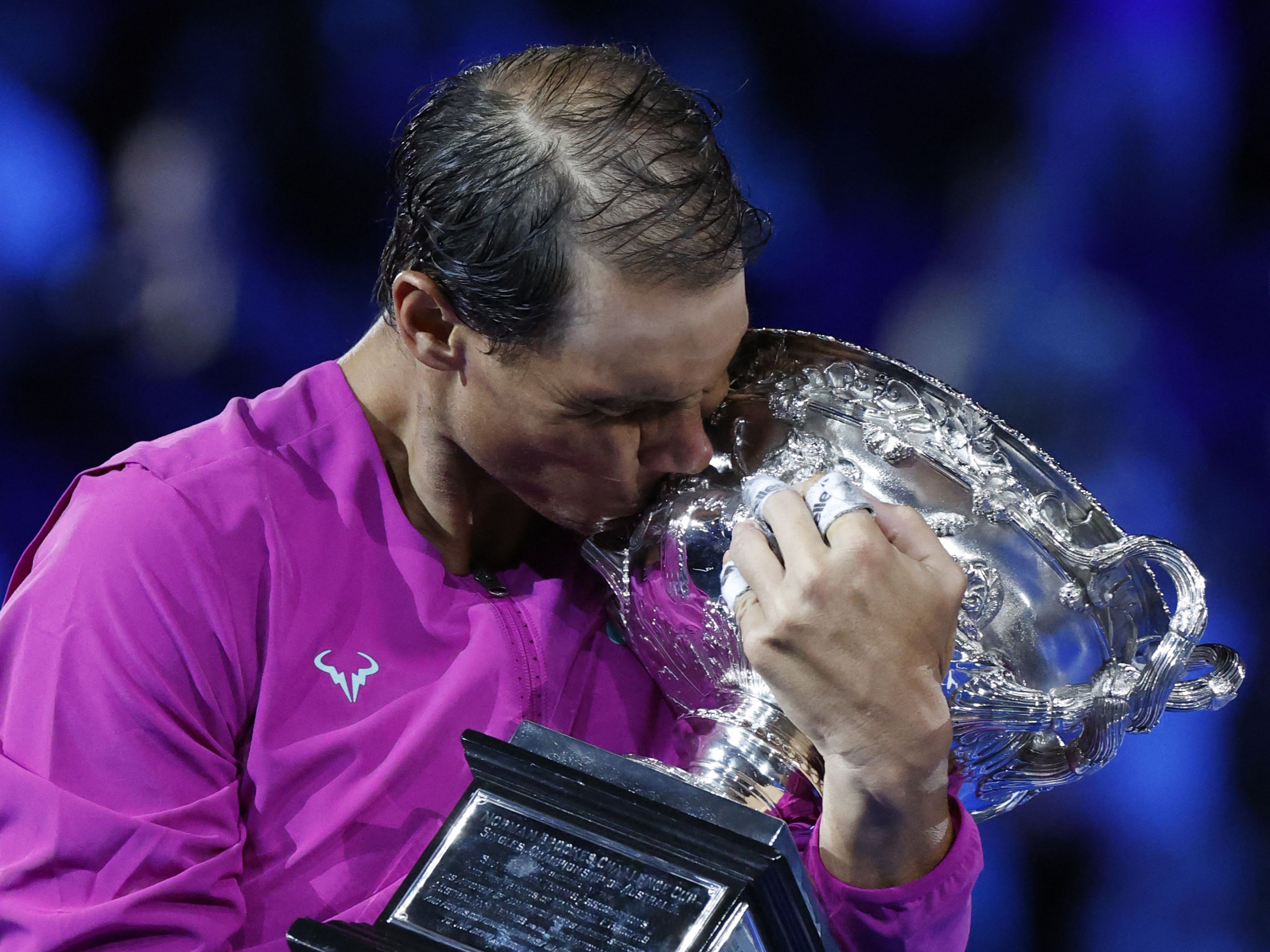 Tennis - Australian Open - Men's Singles Final - Melbourne Park, Melbourne, Australia - January 31, 2022 Spain's Rafael Nadal celebrates winning the final with trophy REUTERS/Asanka Brendon Ratnayake