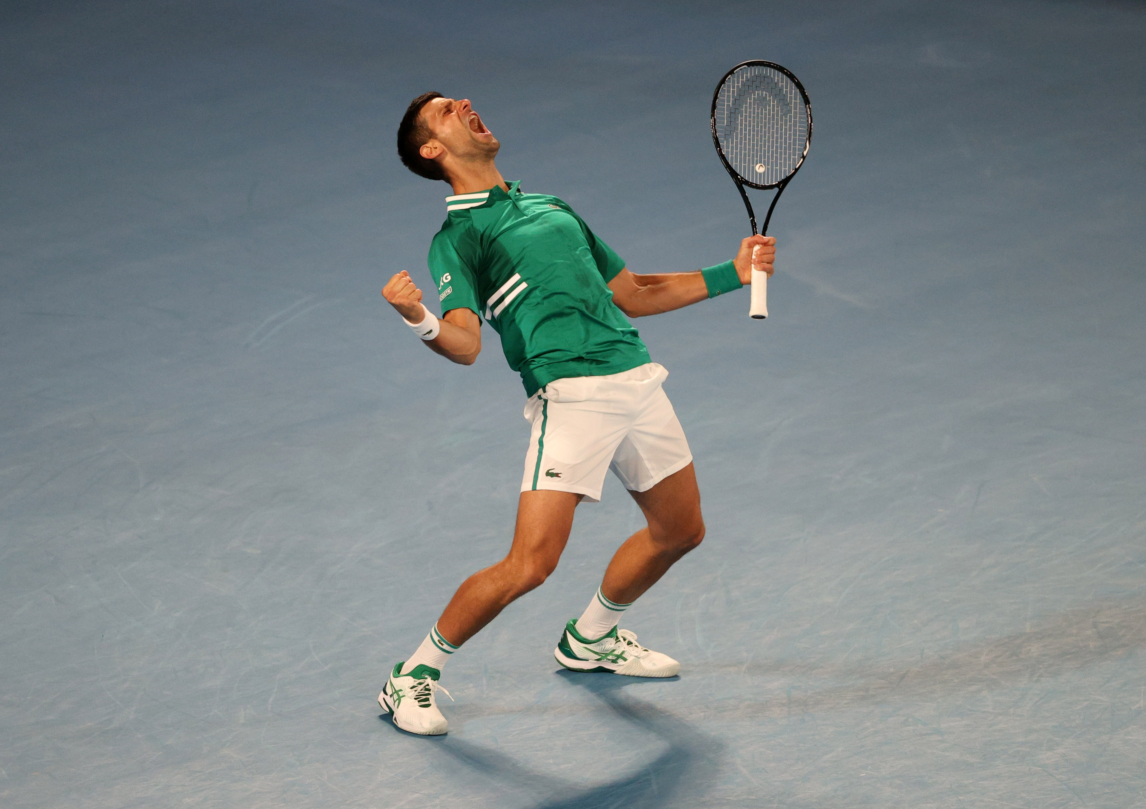 Tennis - Australian Open - Melbourne Park, Melbourne, Australia, February 13, 2021  Serbia's Novak Djokovic celebrates after winning his third round match against Taylor Fritz of the U.S. REUTERS/Loren Elliott     TPX IMAGES OF THE DAY