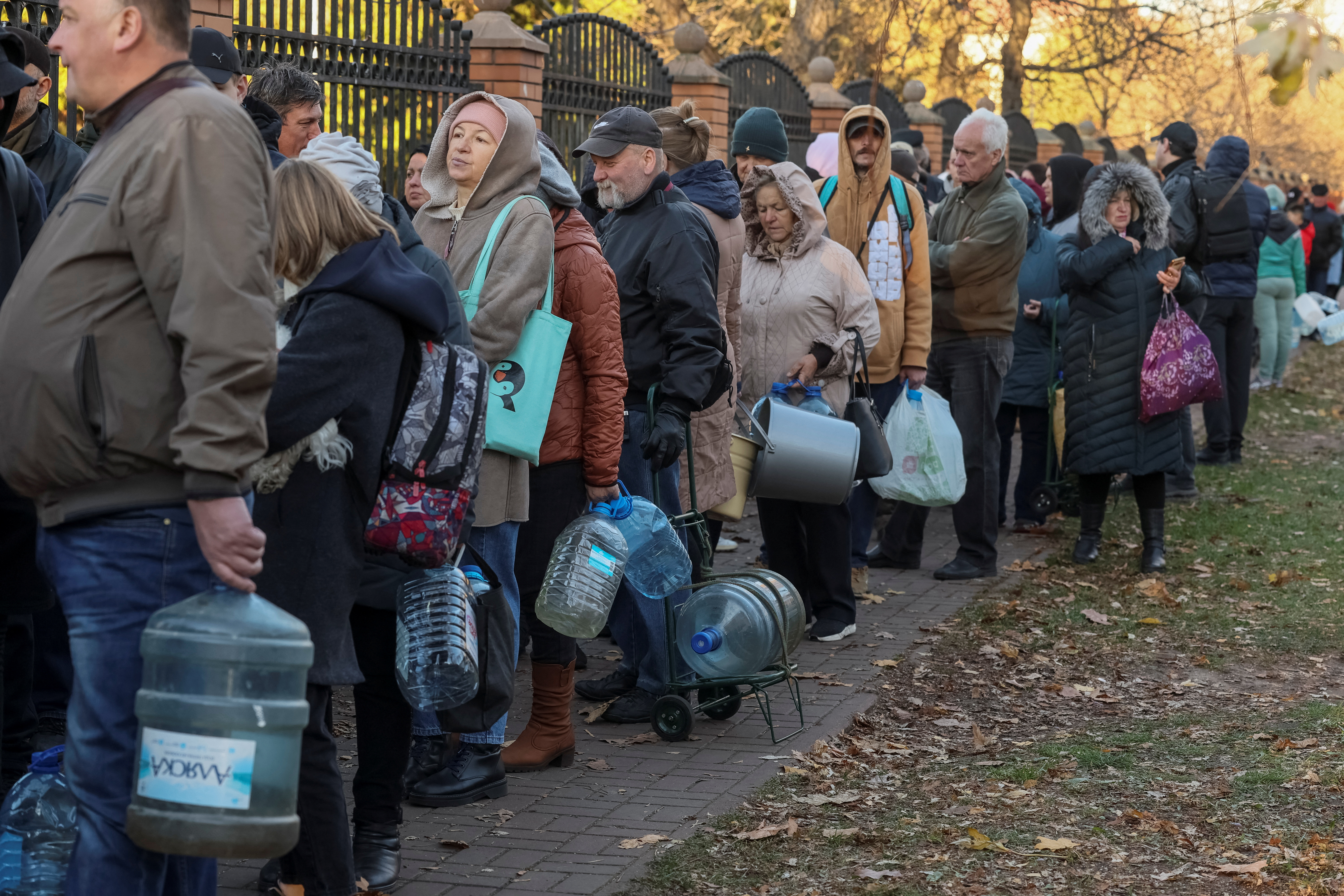 Local residents queue for water after a Russian missile attack in Kyiv