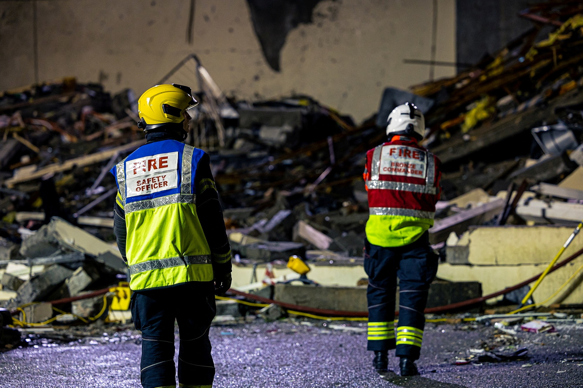 Search crew work at a blast site at a block of flats in Saint Helier, on the island of Jersey