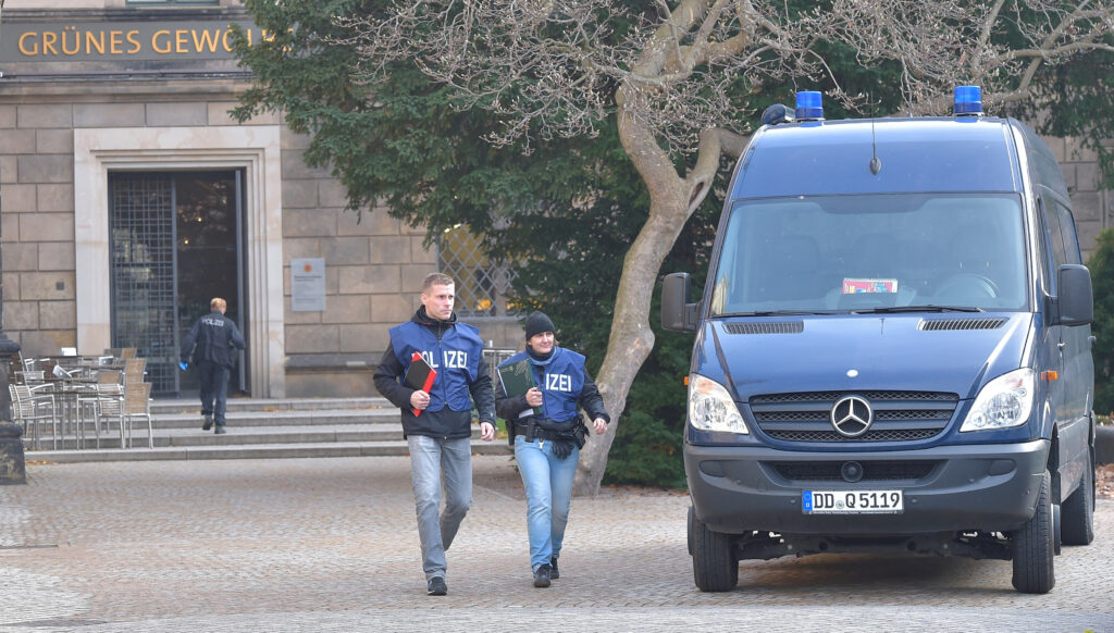 FILE PHOTO: Police officers leave the Green Vault city palace, unique historic museum that contains the largest collection of treasures in Europe after a robbery in Dresden, Germany, November 25, 2019. REUTERS/Matthias Rietschel/File Photo