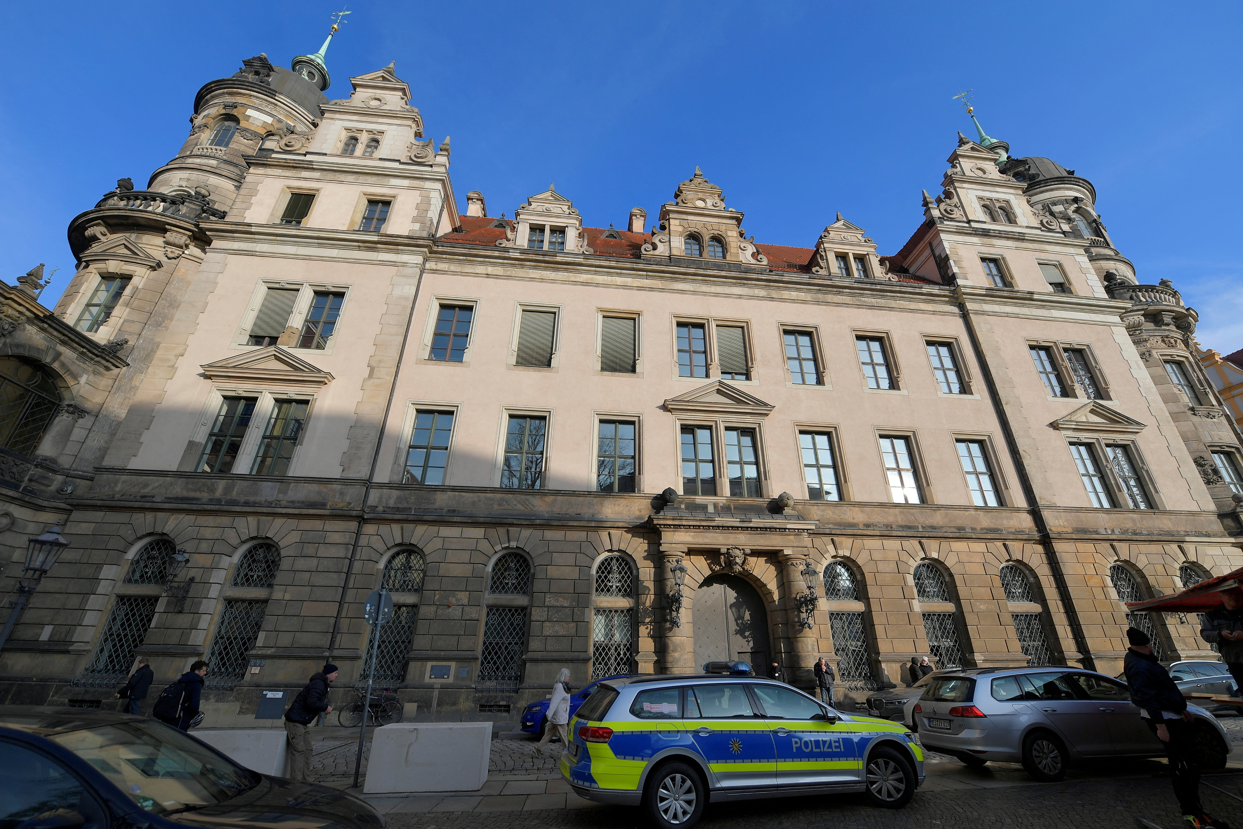 FILE PHOTO: Police car parks outside Green Vault city palace, unique historic museum that contains the largest collection of treasures in Europe after a robbery in Dresden, Germany, November 25, 2019. REUTERS/Matthias Rietschel/File Photo