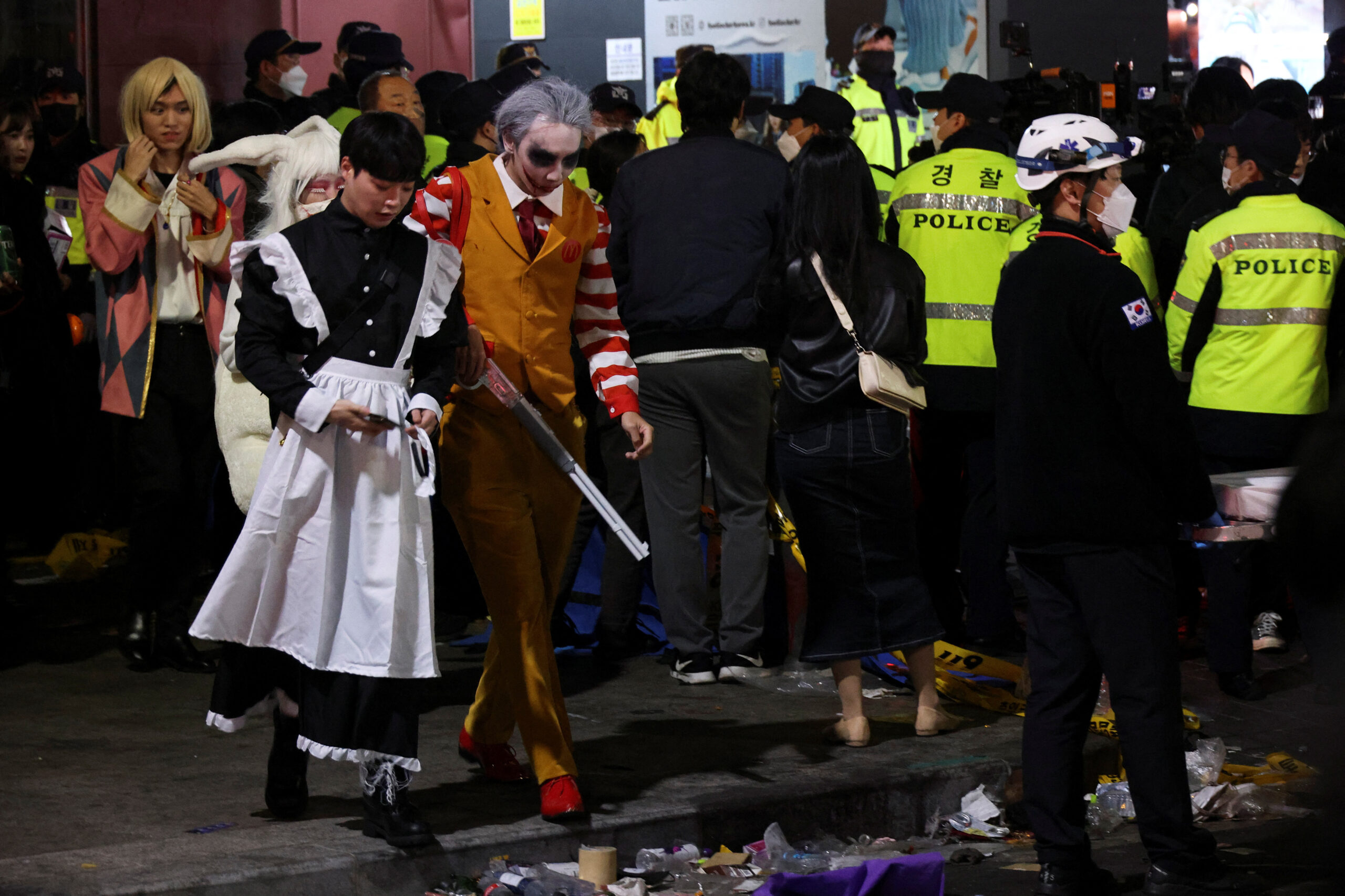 Partygoers leave the the scene where many people died and were injured in a stampede during a Halloween festival in Seoul, South Korea, October 30, 2022. REUTERS/Kim Hong-ji