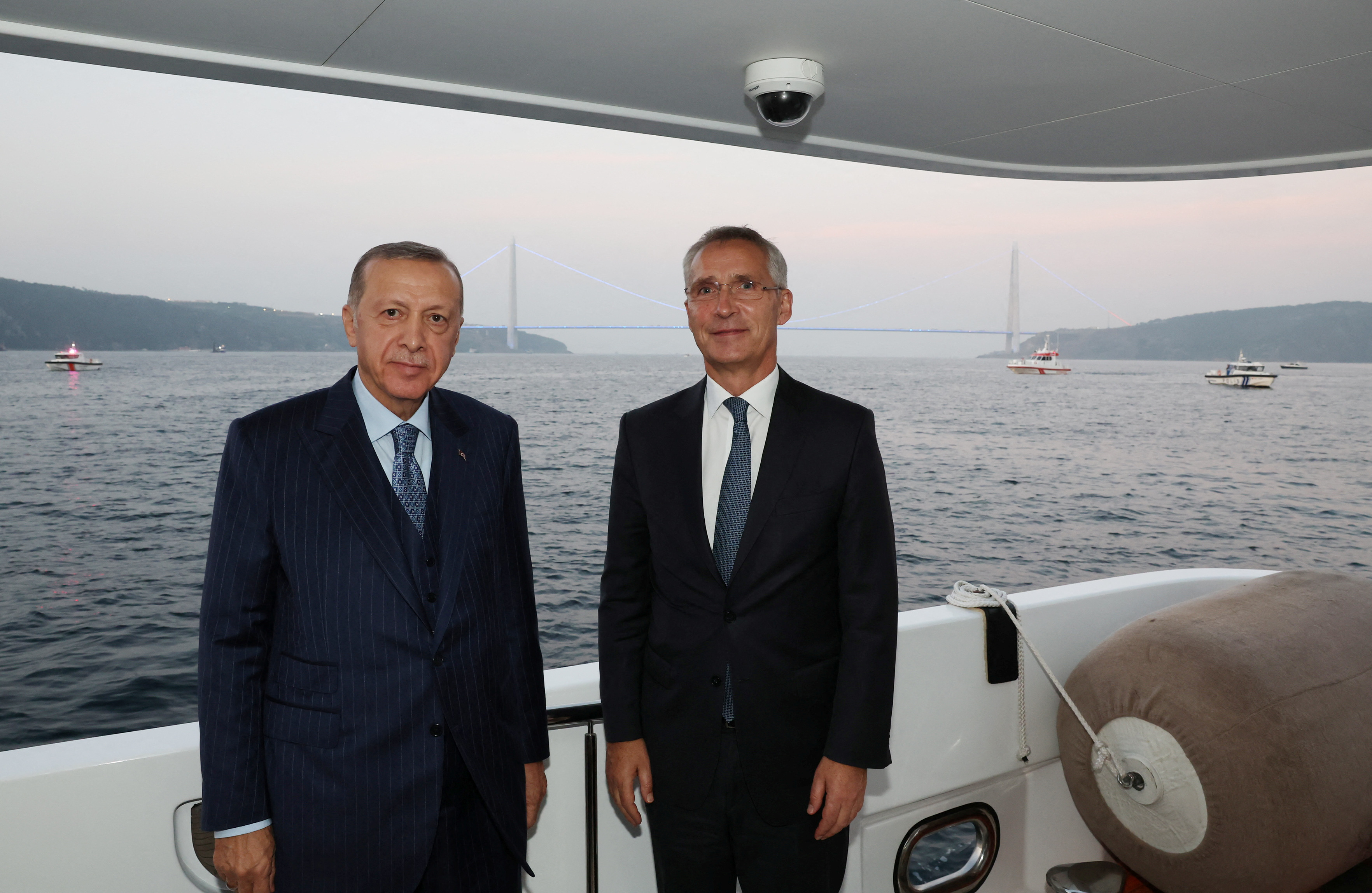 Turkish President Tayyip Erdogan and NATO Secretary-General Jens Stoltenberg pose as they sail through Bosphorus in Istanbul