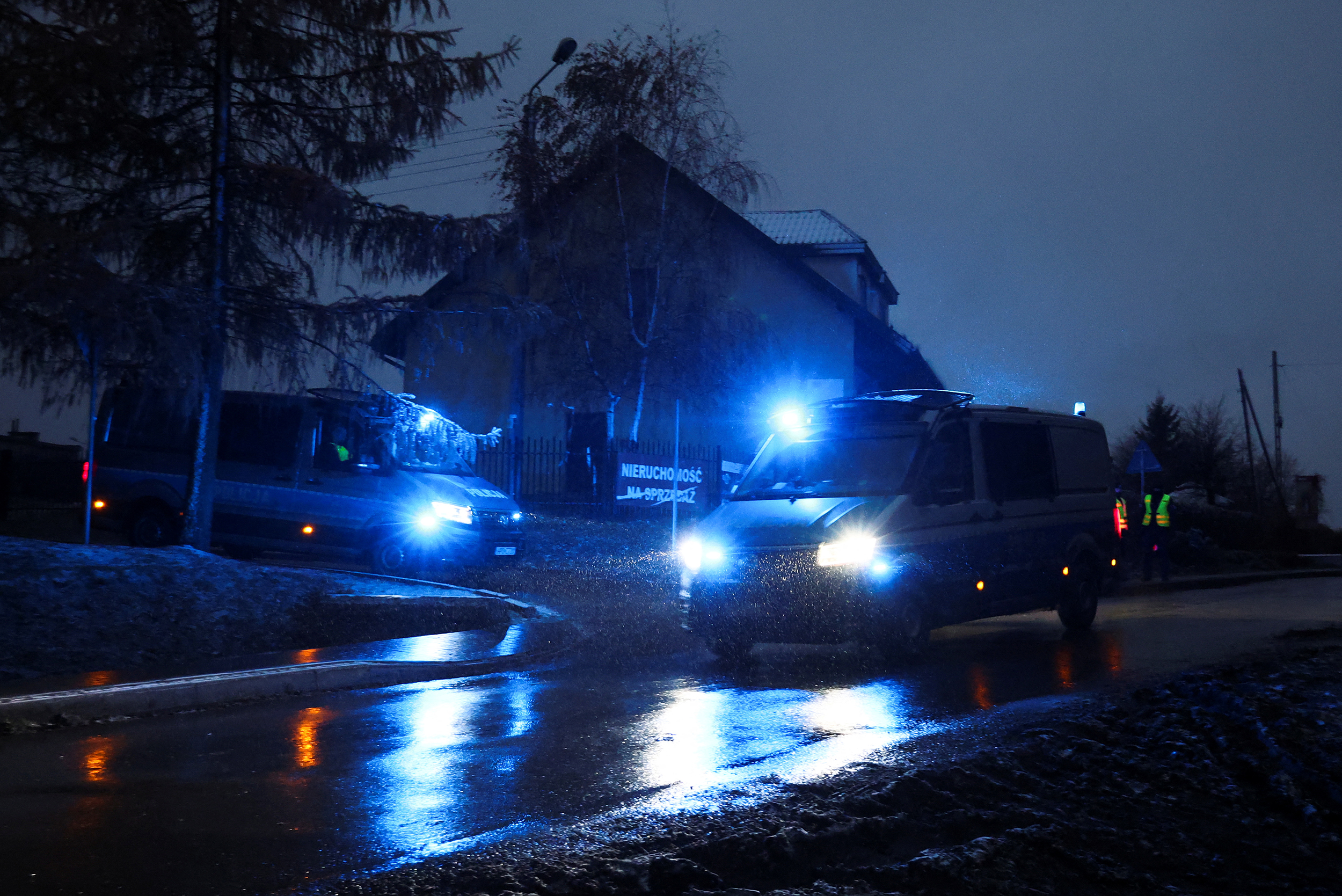 Police vehicles gather at a blockade near the site of an explosion in Przewodow, a village in eastern Poland near the border with Ukraine, November 18, 2022. REUTERS/Kacper Pempel