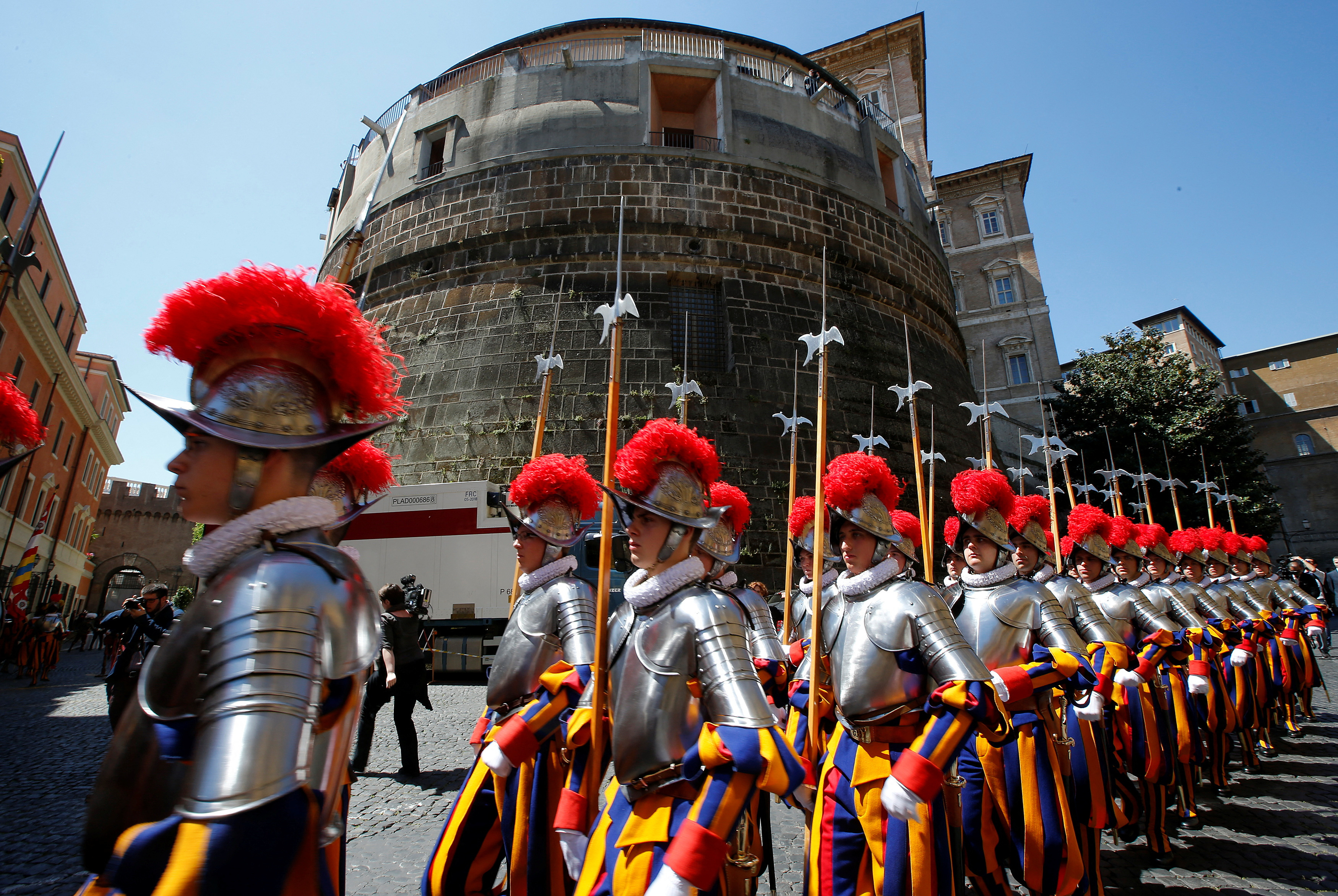 FILE PHOTO: The Vatican's elite Swiss Guards march in front of the Vatican bank tower at the Vatican,  May 6, 2014. REUTERS/Tony Gentile/File Photo