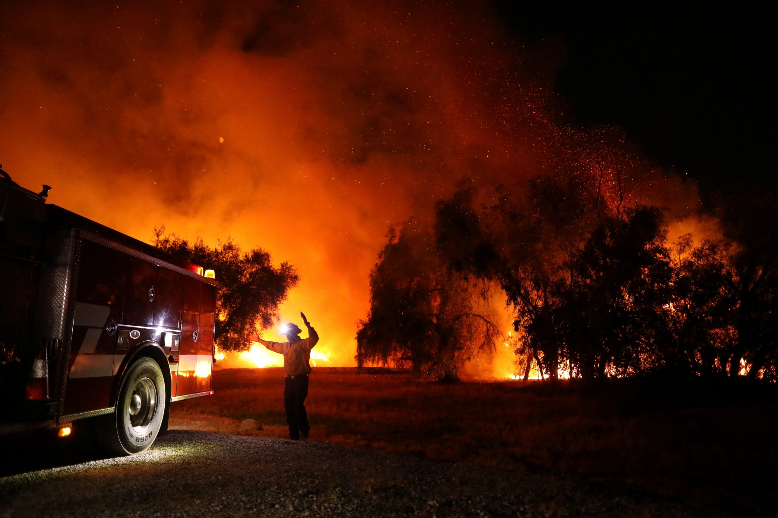 A firefighter responds as the Fairview Fire burns near Hemet, California, U.S., September 5, 2022.  REUTERS/David Swanson