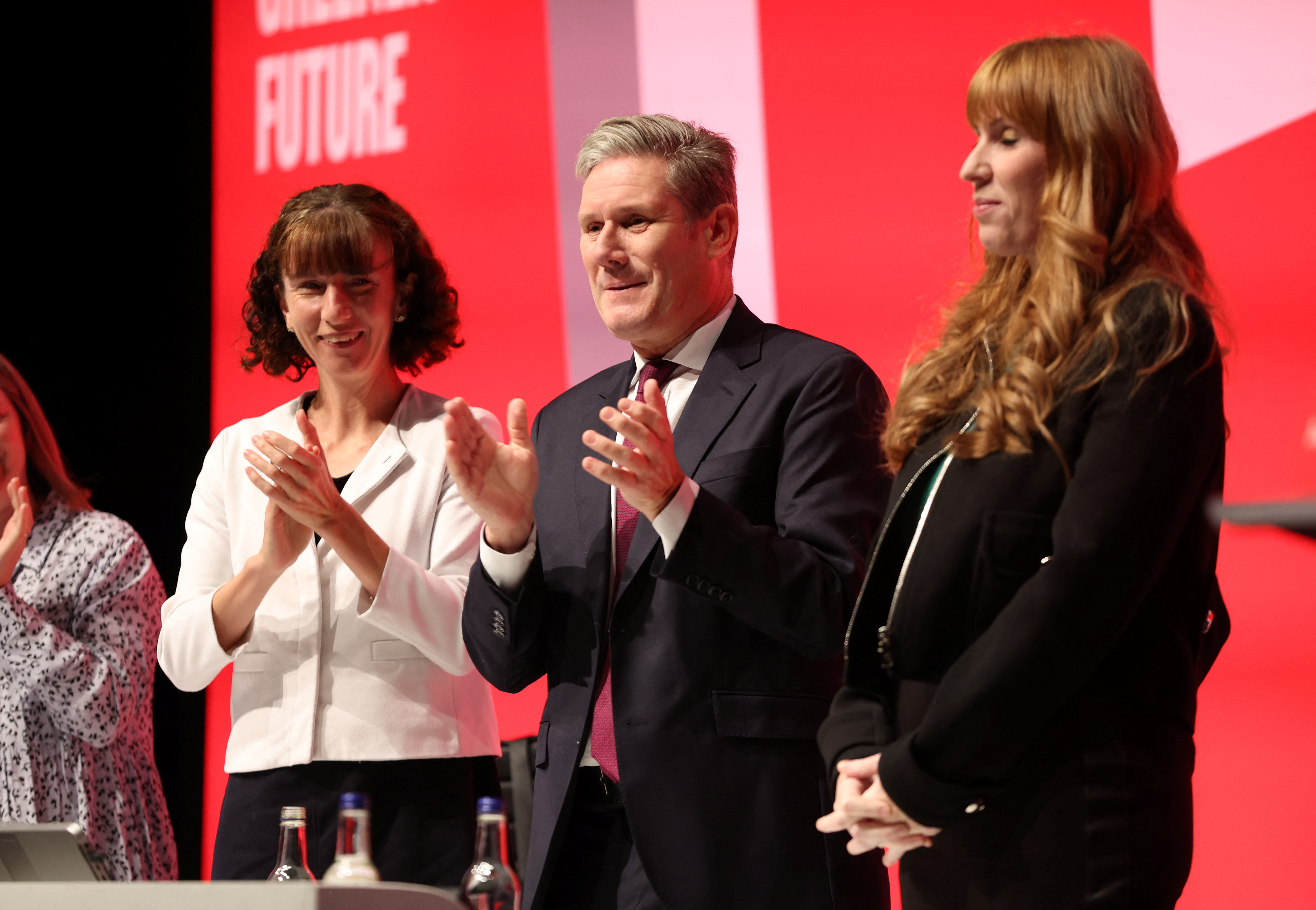 Britain's Labour Party leader Keir Starmer, Labour Party Chair Anneliese Dodds applaud after deputy leader Angela Rayner's speech at Britain's Labour Party's annual conference in Liverpool, Britain, September 25, 2022. REUTERS/Phil Noble