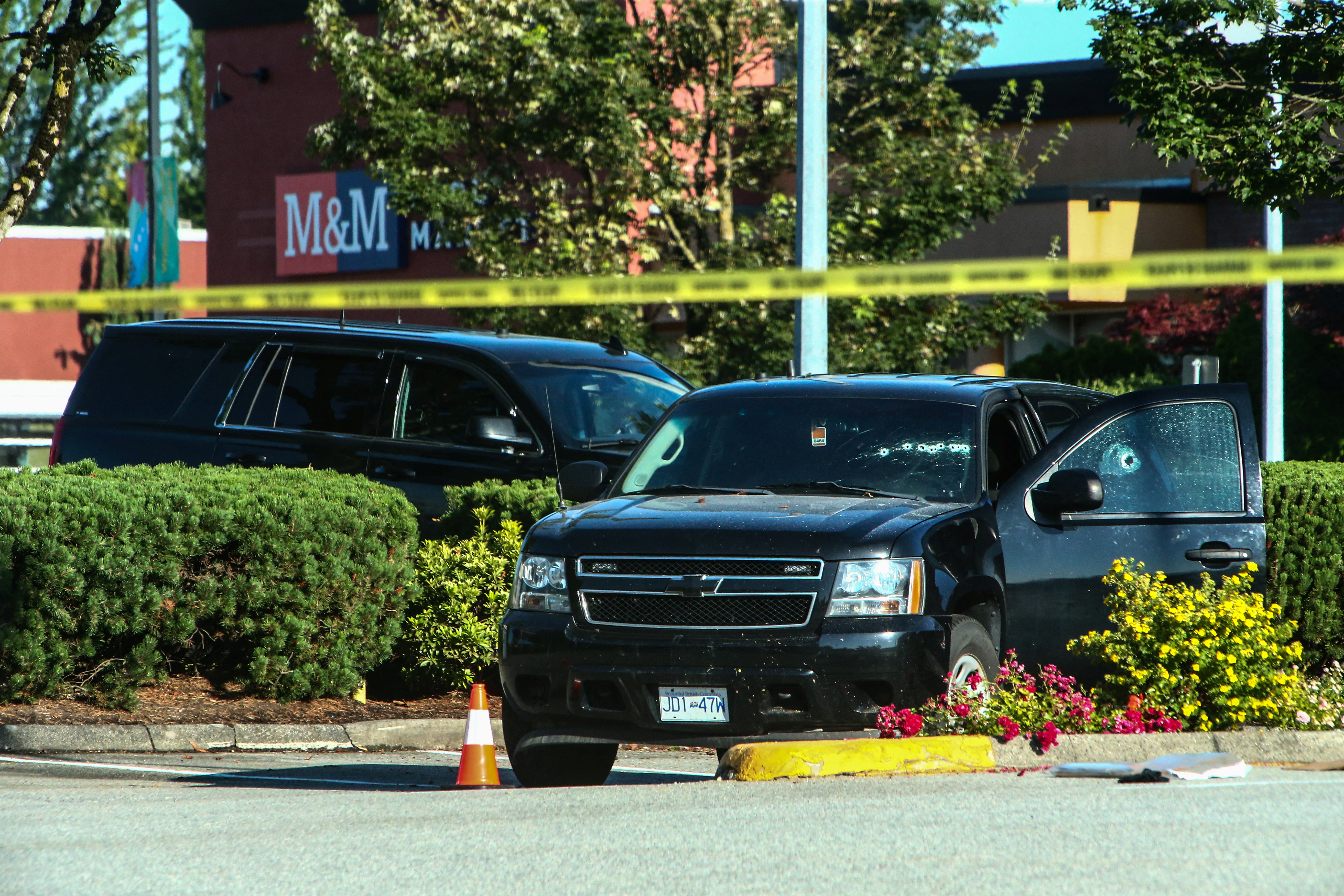 A car with bullet holes visible on the windshield is seen at the site after authorities alerted residents of multiple shootings targeting transient victims in the Vancouver suburb of Langley, British Columbia, Canada July 25, 2022.  REUTERS/Jesse Winter