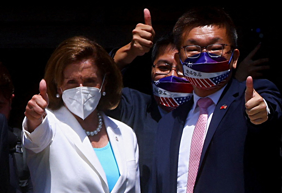 U.S. House of Representatives Speaker Nancy Pelosi gestures next to Legislative Yuan Vice President Tsai Chi-chang as she leaves the parliament in Taipei, Taiwan August 3, 2022. REUTERS/Ann Wang