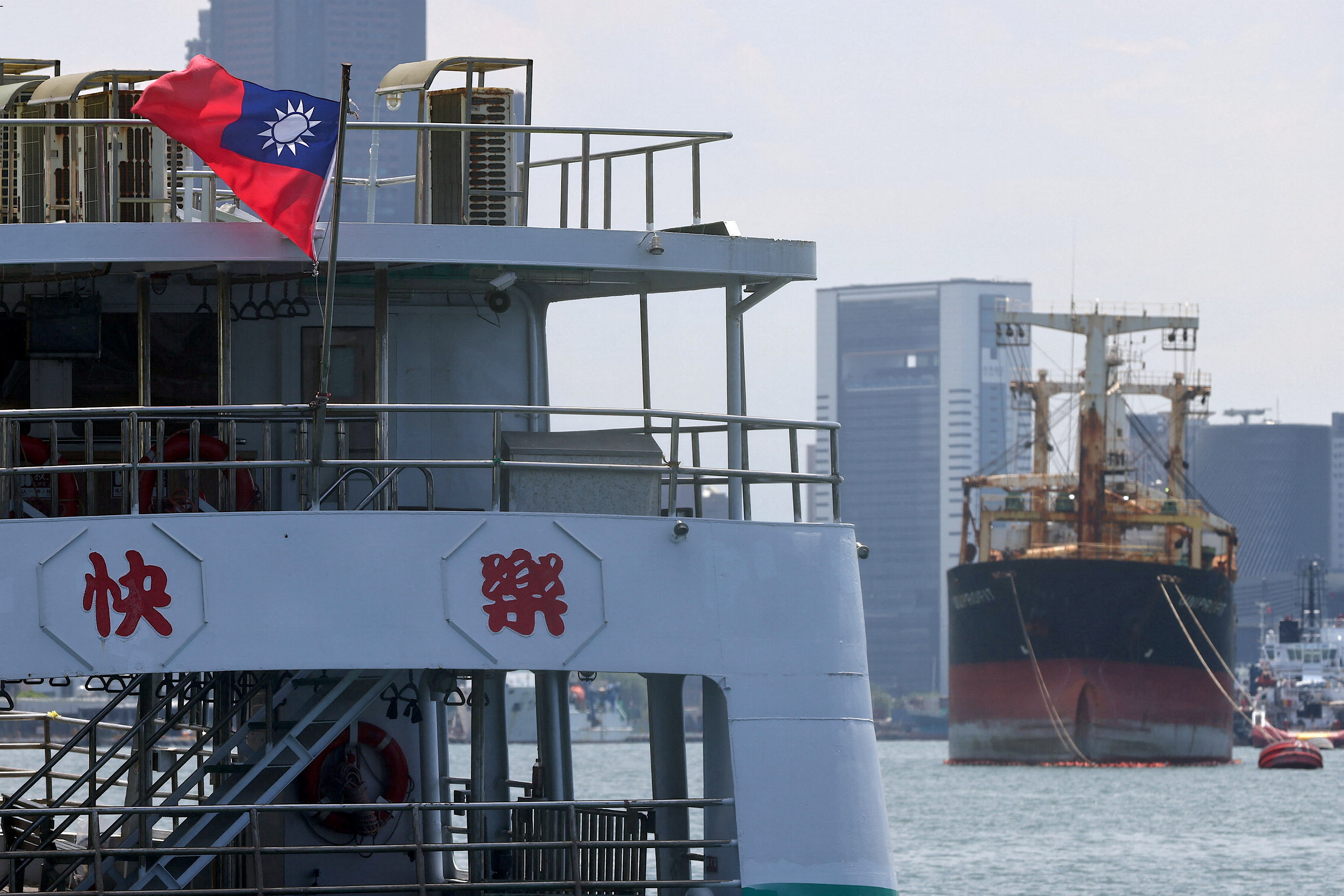 A Taiwan flag flutters on a ferry boat in Kaohsiung, Taiwan, August 5, 2022. REUTERS/Ann Wang