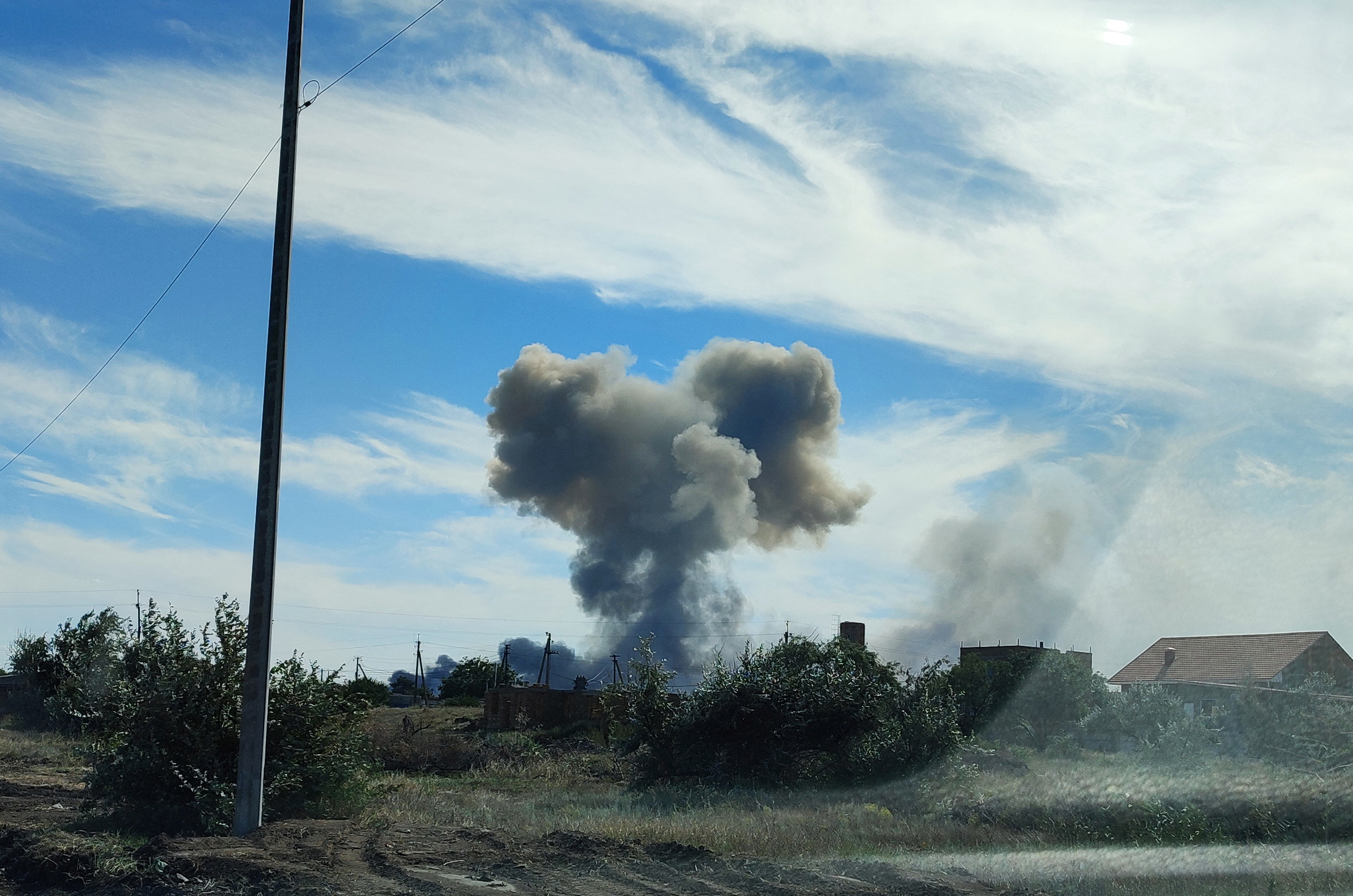 Smoke rises after explosions were heard from the direction of a Russian military airbase near Novofedorivka, Crimea August 9, 2022. REUTERS/Stringer