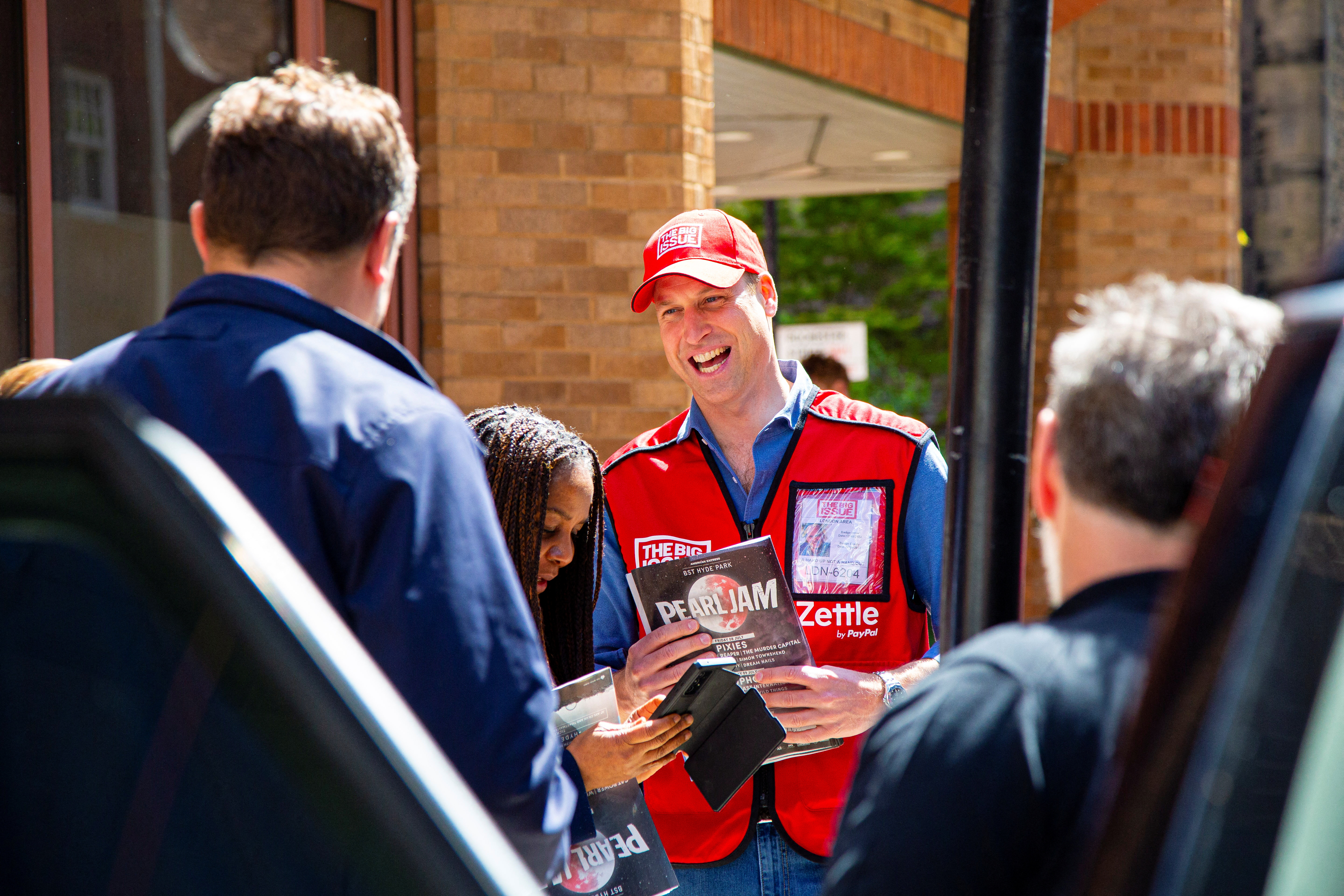 Britain's Prince William works as a vendor of The Big Issue newspaper