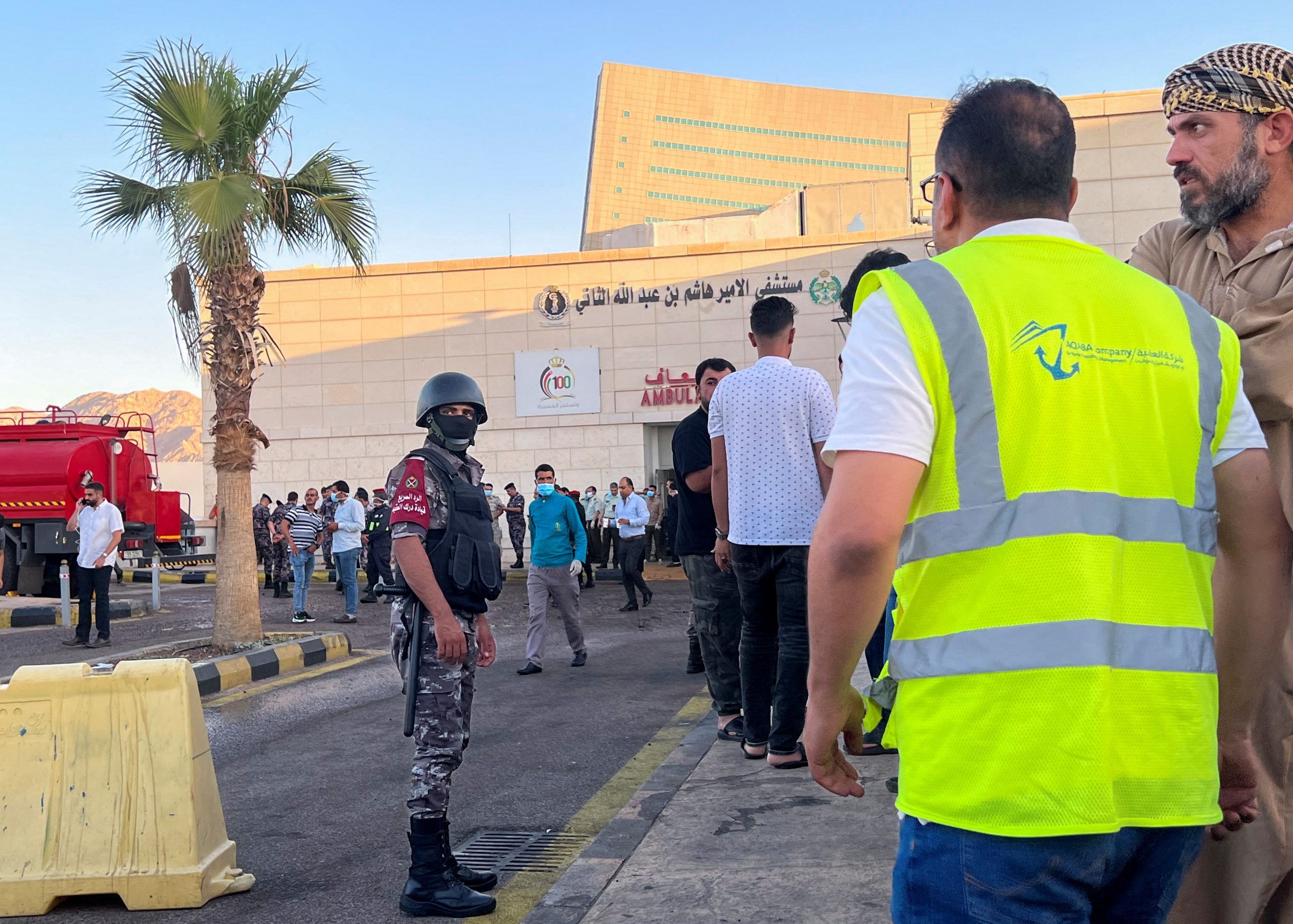 People stand outside a hospital after toxic gas leak from a storage tank in Jordan's Aqaba port, Jordan June 27, 2022. REUTERS/Abraham Farajian   NO RESALES. NO ARCHIVES
