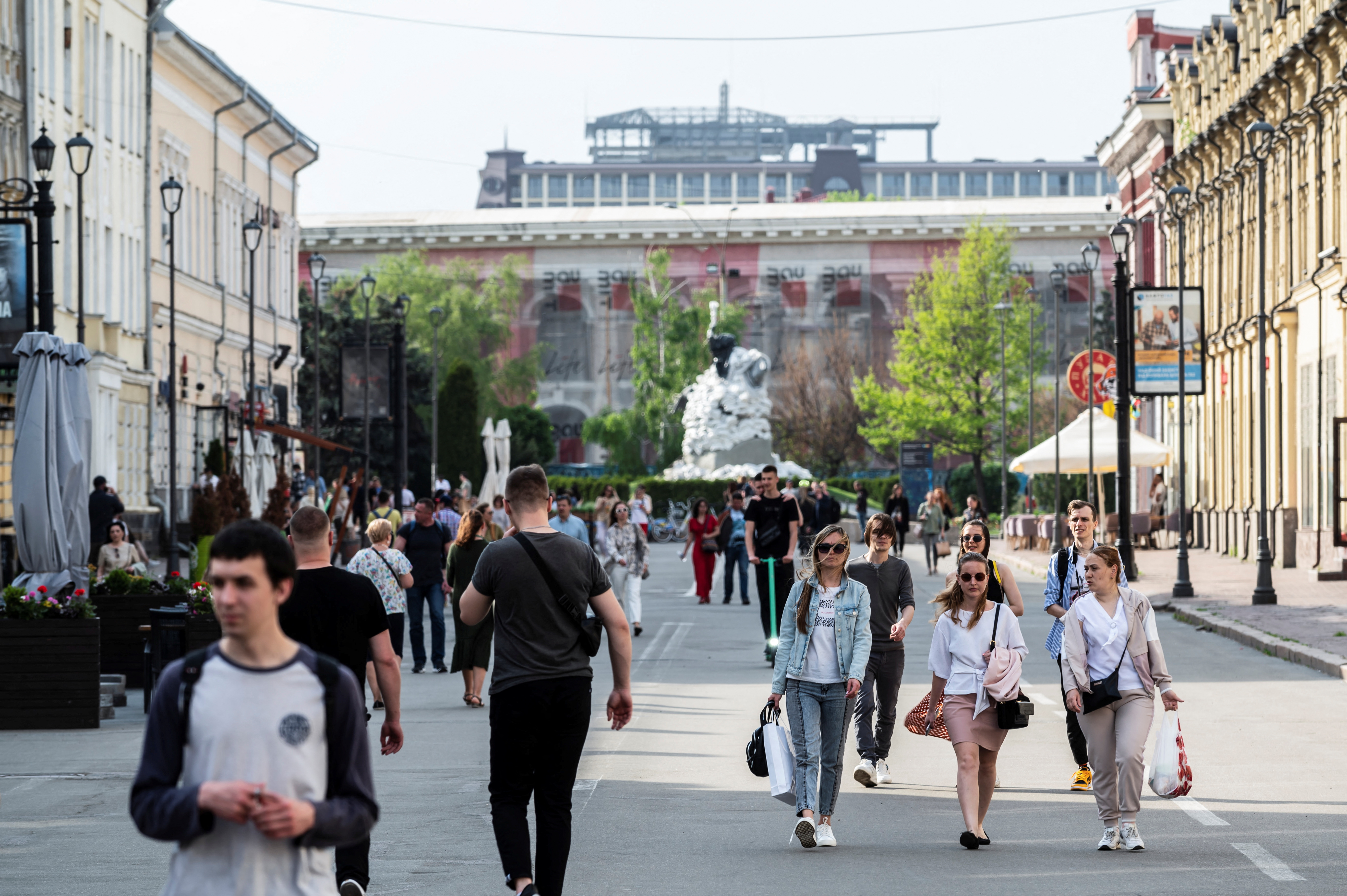 People walk along a street, amid Russia's invasion of Ukraine, in Kyiv, Ukraine May 12, 2022. REUTERS/Viacheslav Ratynskyi