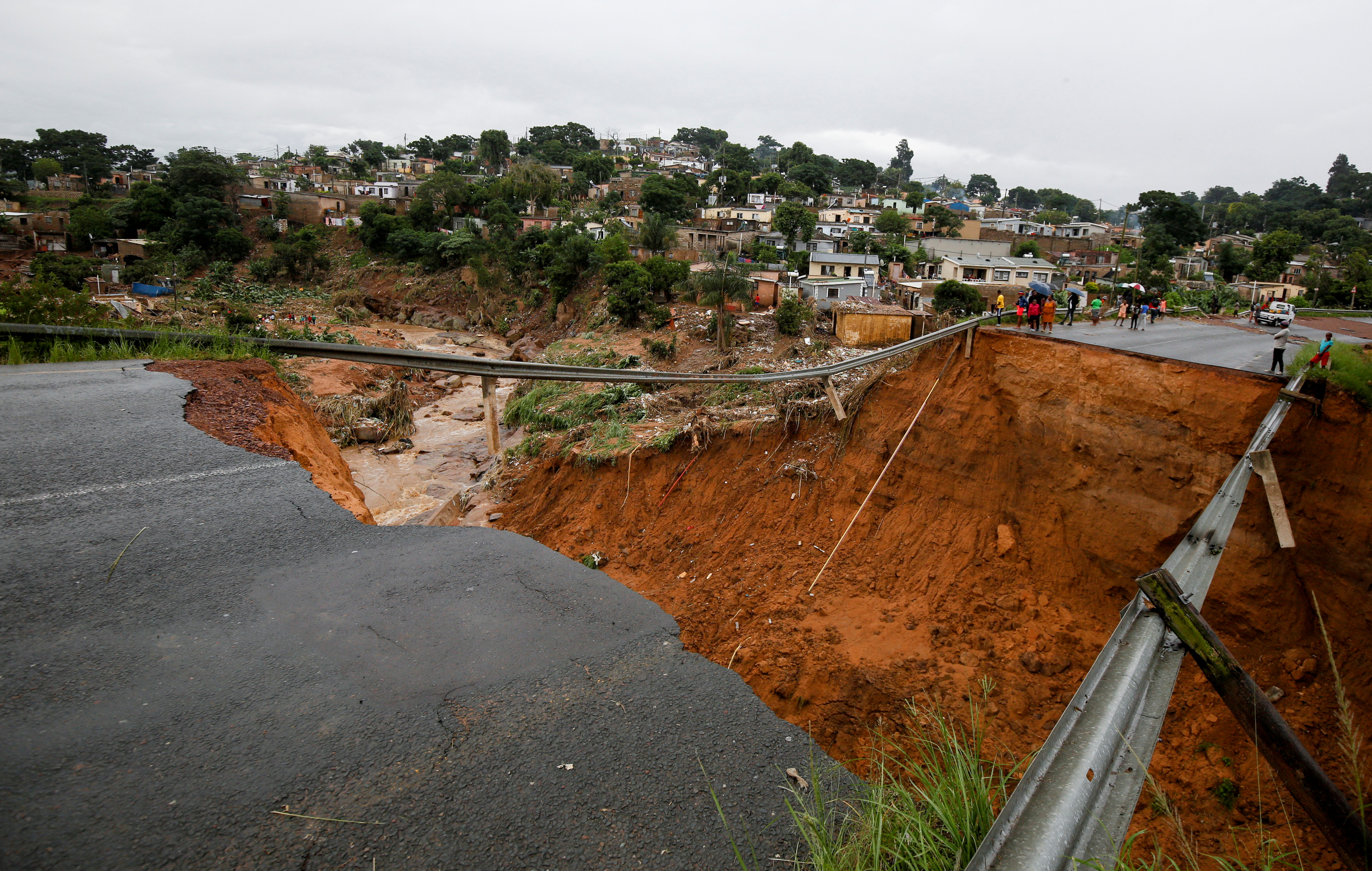 A bridge was destroyed after a river burst its banks in Ntuzuma, Durban, South Africa, April 13, 2022. REUTERS/Rogan Ward