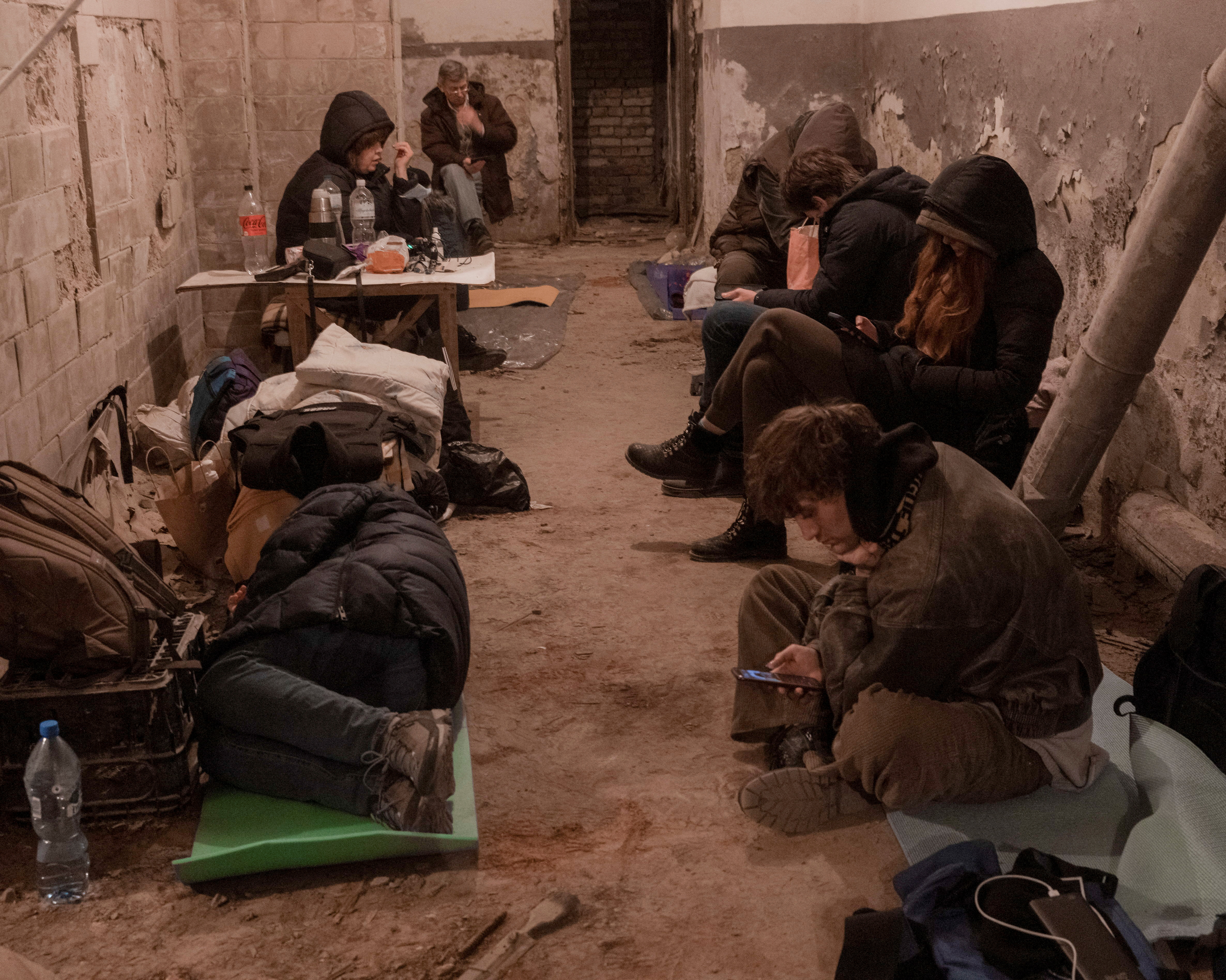 Residents take shelter in the basement of an apartment building in Kyiv