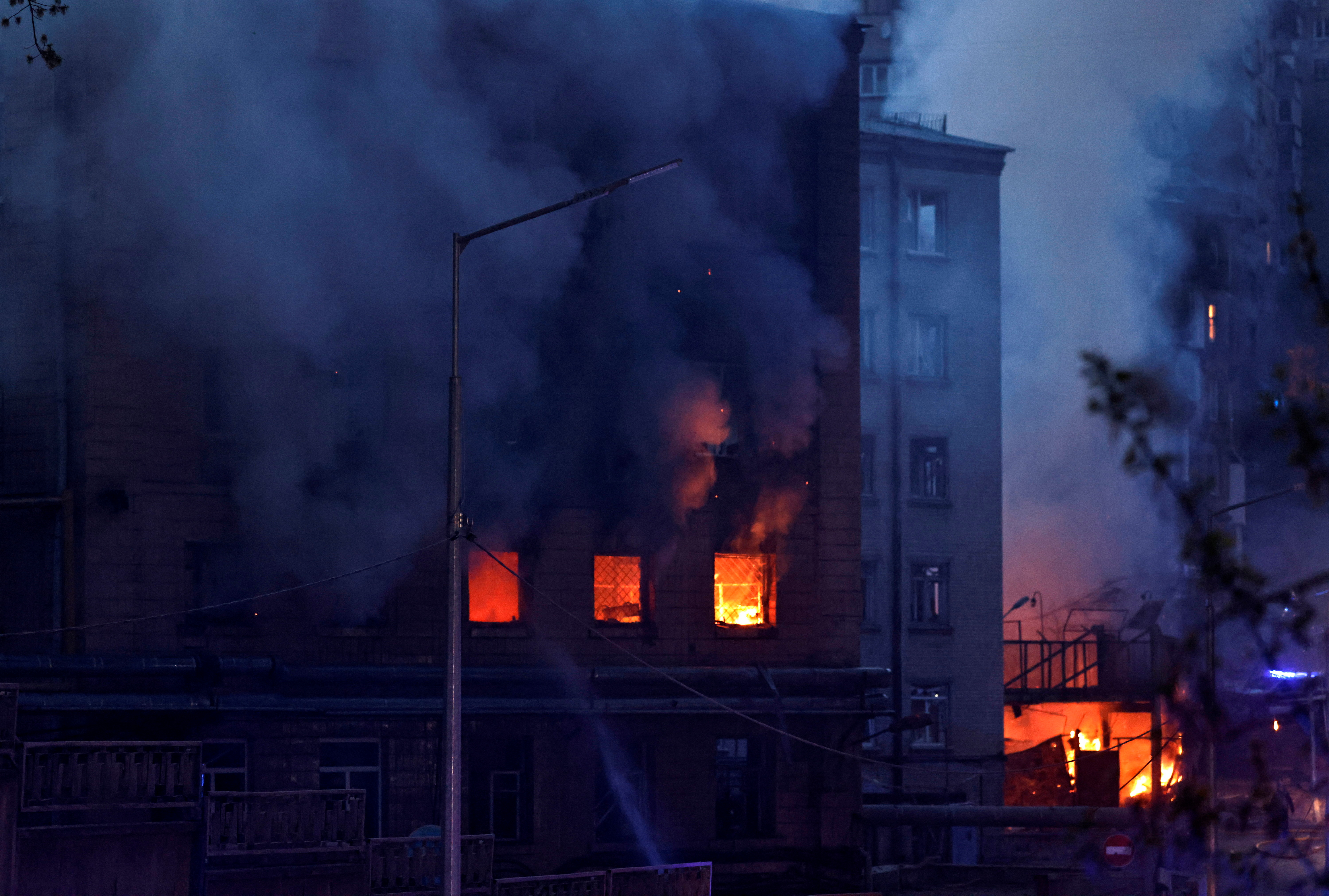 Fire burns in a building after a shelling, amid Russia's invasion of Ukraine, in Kyiv, Ukraine April 28, 2022. REUTERS/Zohra Bensemra