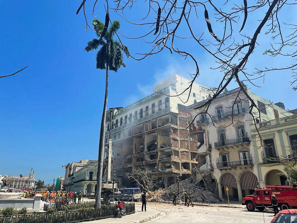 Rescue teams work at a site after an explosion destroyed the Hotel Saratoga, in Havana, Cuba May 6, 2022. REUTERS/Alexandre Meneghini