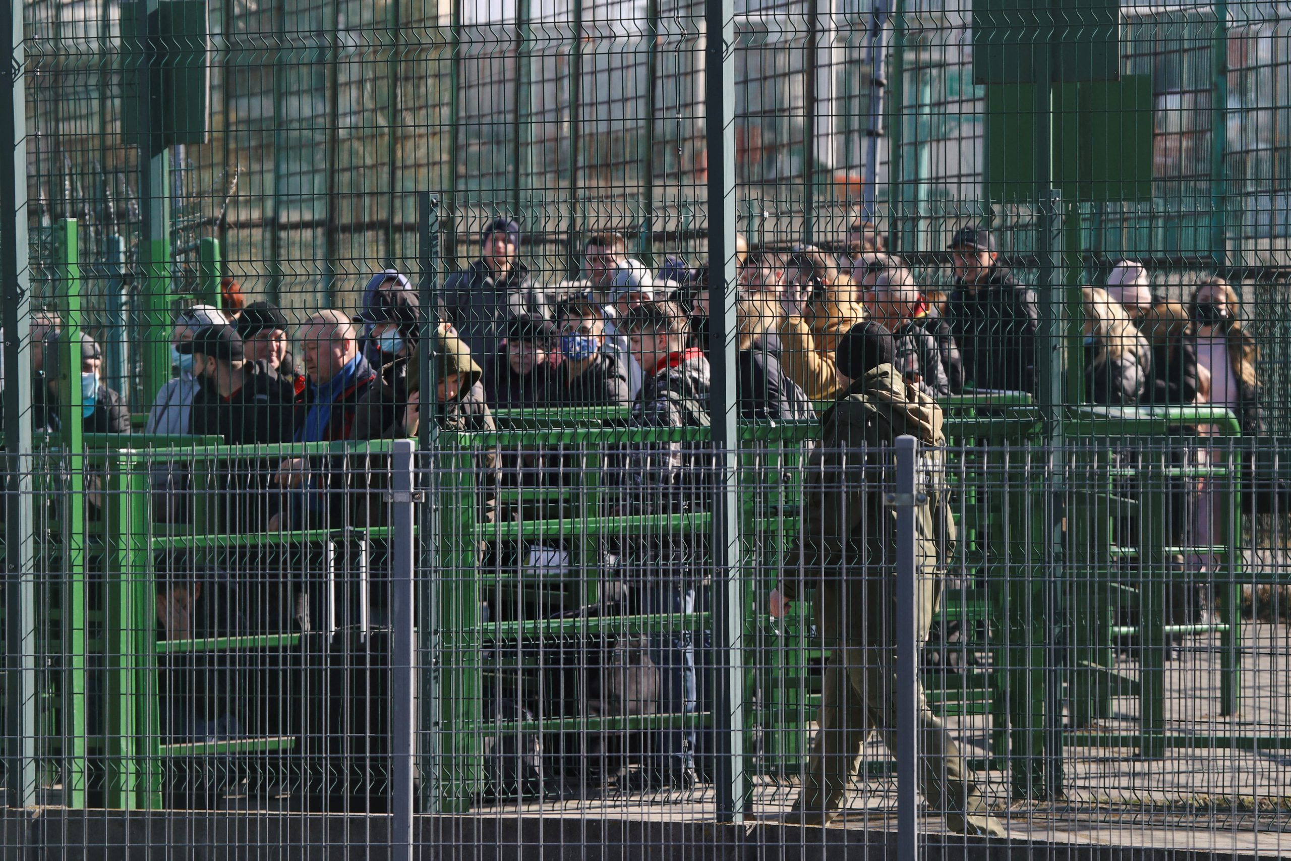 People wait at the Ukranian side of the border crossing between Poland and Ukraine, after Russian President Vladimir Putin authorized a military operation in eastern Ukraine, as seen from Medyka, Poland, February 24, 2022. REUTERS/Kacper Pempel