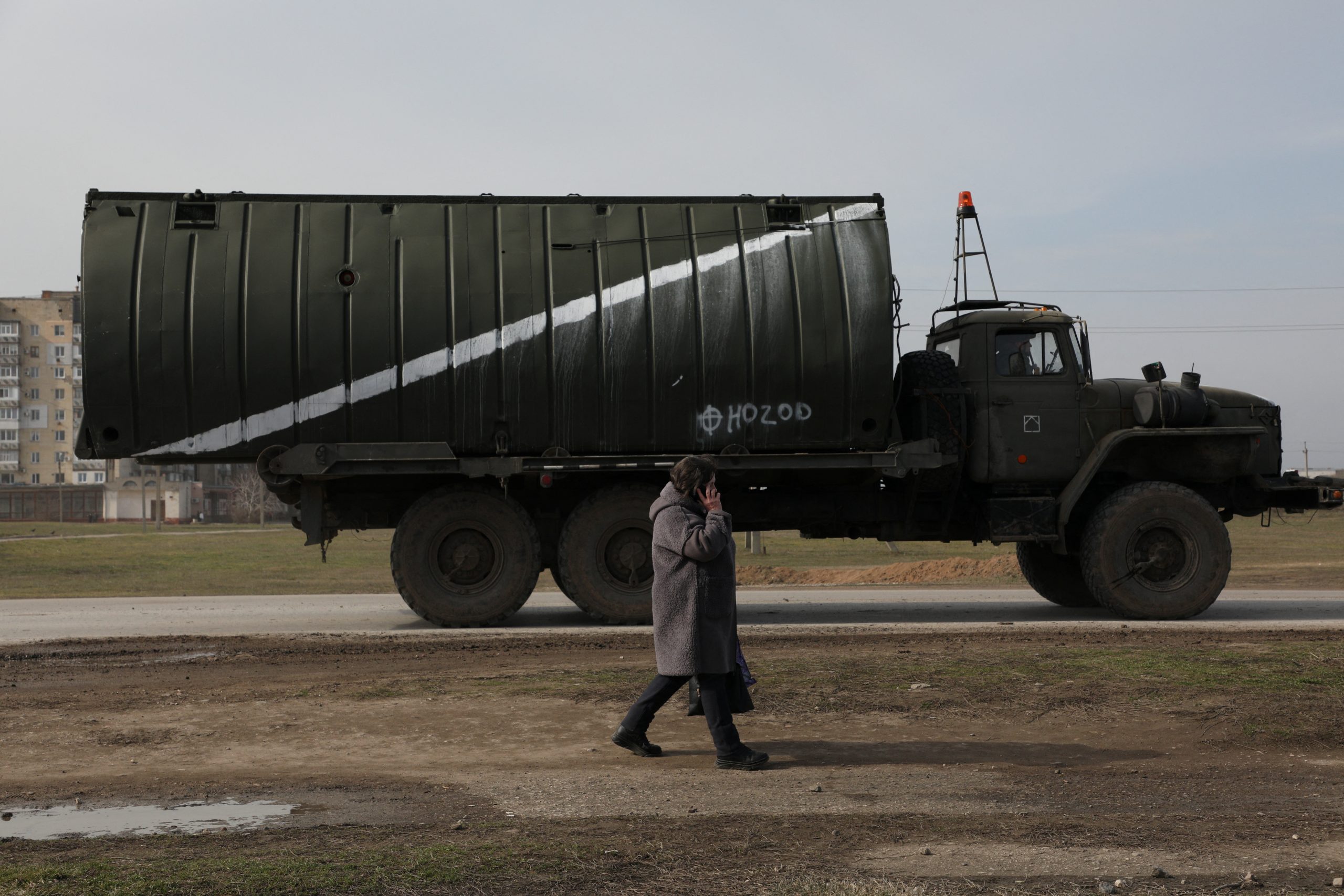 A military vehicle drives along a street, after Russian President Vladimir Putin authorized a military operation in eastern Ukraine, in the town of Armyansk, Crimea, February 24, 2022. REUTERS/Stringer