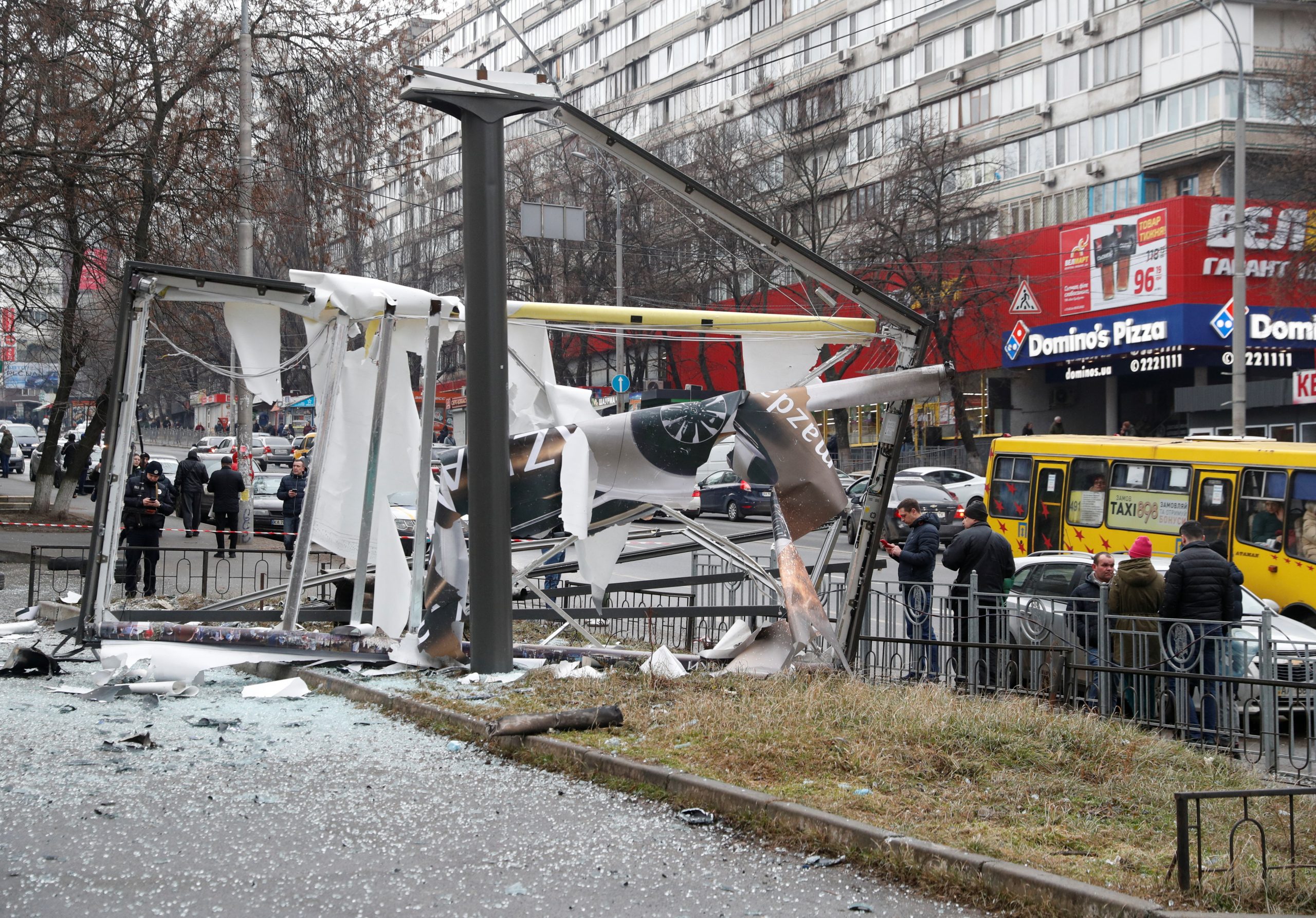 Debris and rubble are seen at the site where a missile landed in the street, after Russian President Vladimir Putin authorized a military operation in eastern Ukraine, in Kyiv, Ukraine February 24, 2022. REUTERS/Valentyn Ogirenko