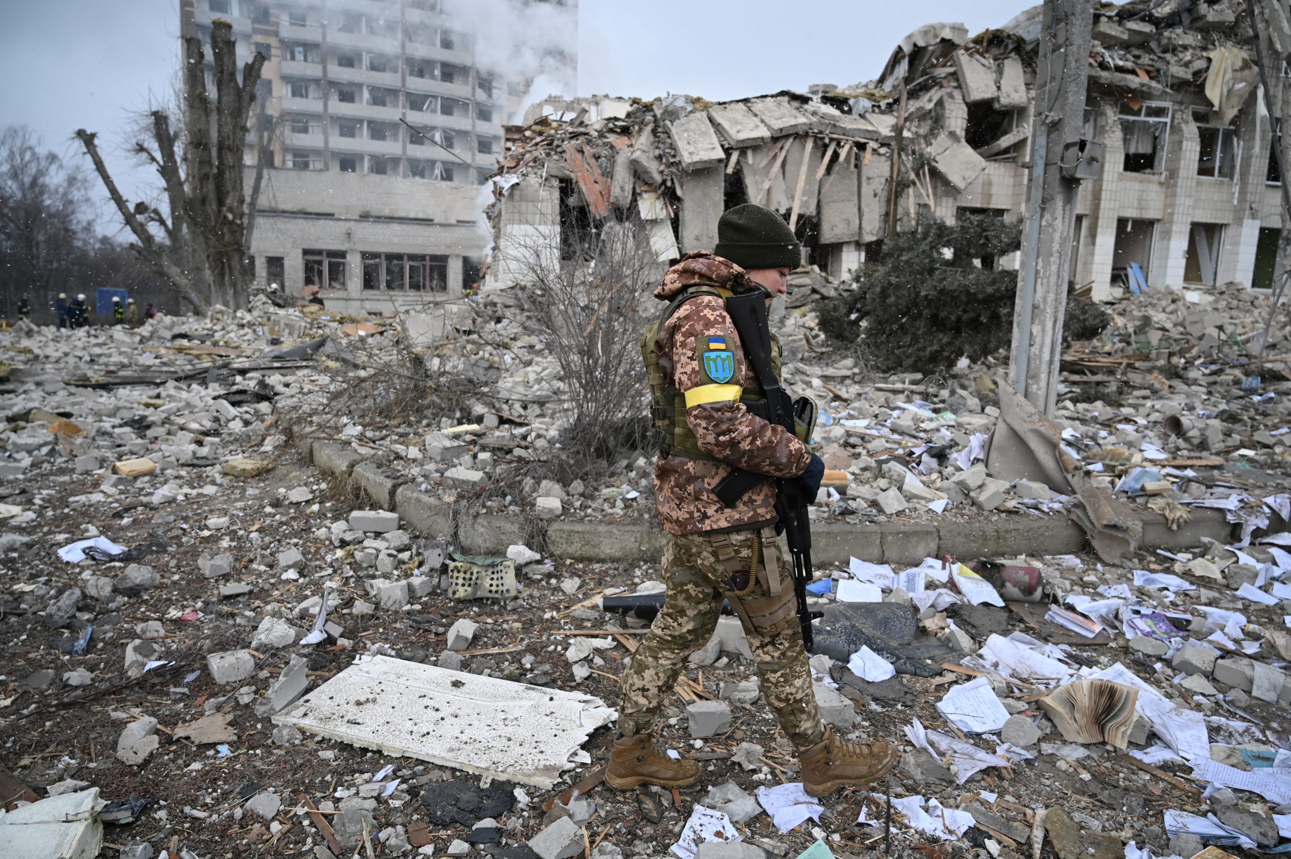 A Ukrainian service member walks near a school building destroyed by shelling, as Russia's invasion of Ukraine continues, in Zhytomyr, Ukraine March 4, 2022. REUTERS/Viacheslav Ratynskyi